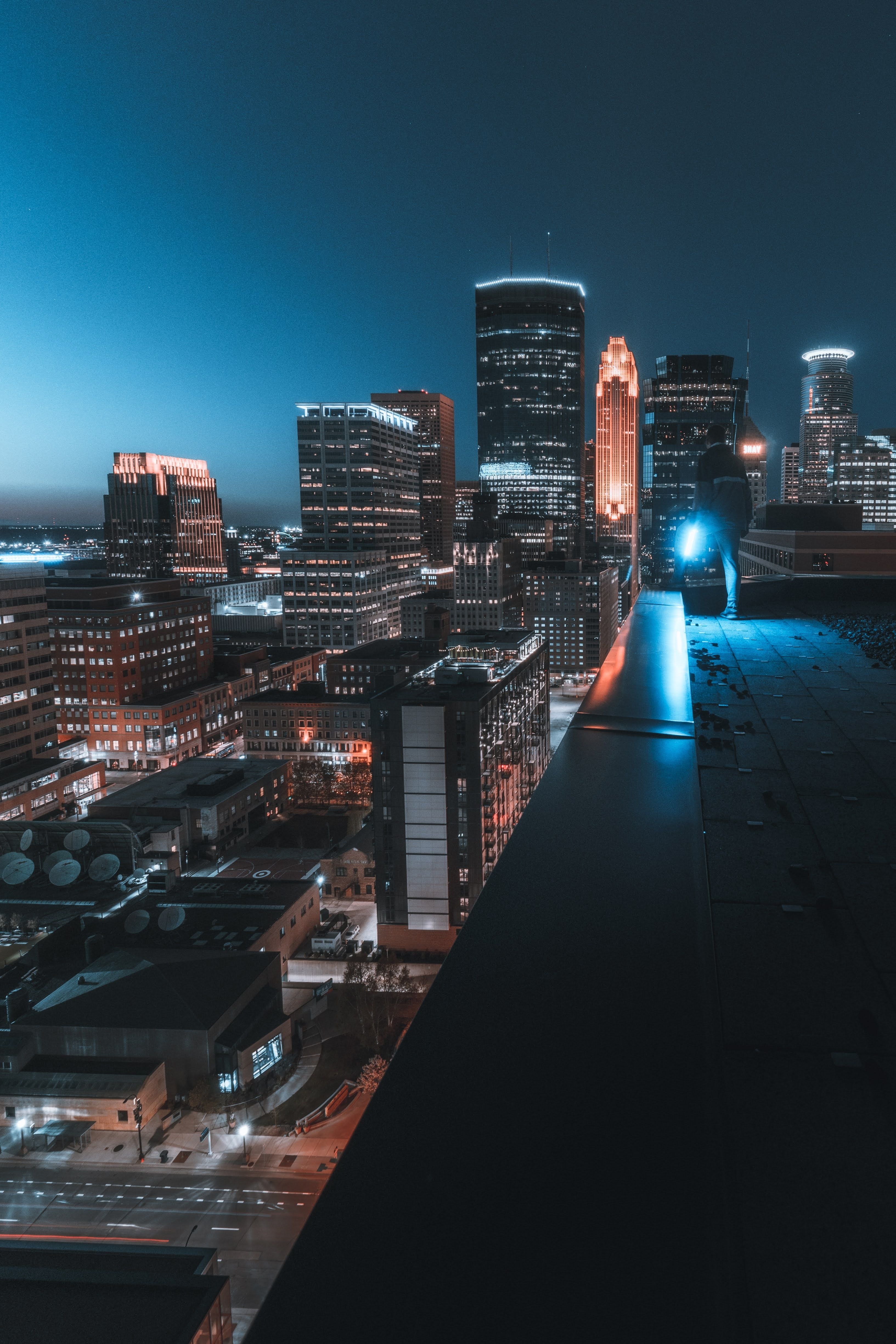 3266x4898 Download wallpaper 3266x4898 buildings, roof, man, city, night HD background
