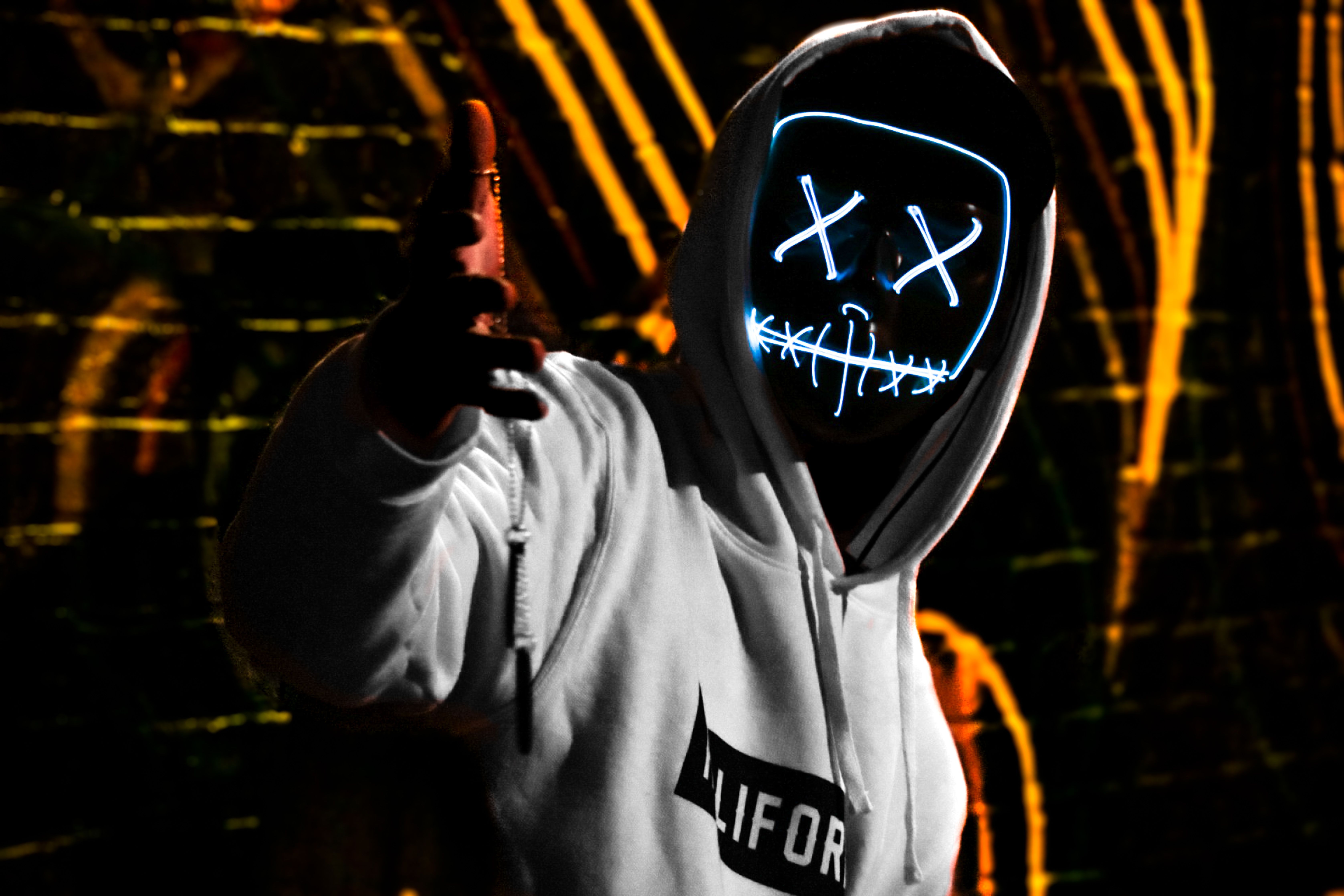 6708x4472 Free of anonymous, artistic, atmospheric, cool, costume, creative lighting, cyberpunk, dark, darkness, digital art, edgy, expression, fashion, flicker, futuristic, glow, glowing mask, graffiti, hoodie, led mask, mask, modern, moody, mystery