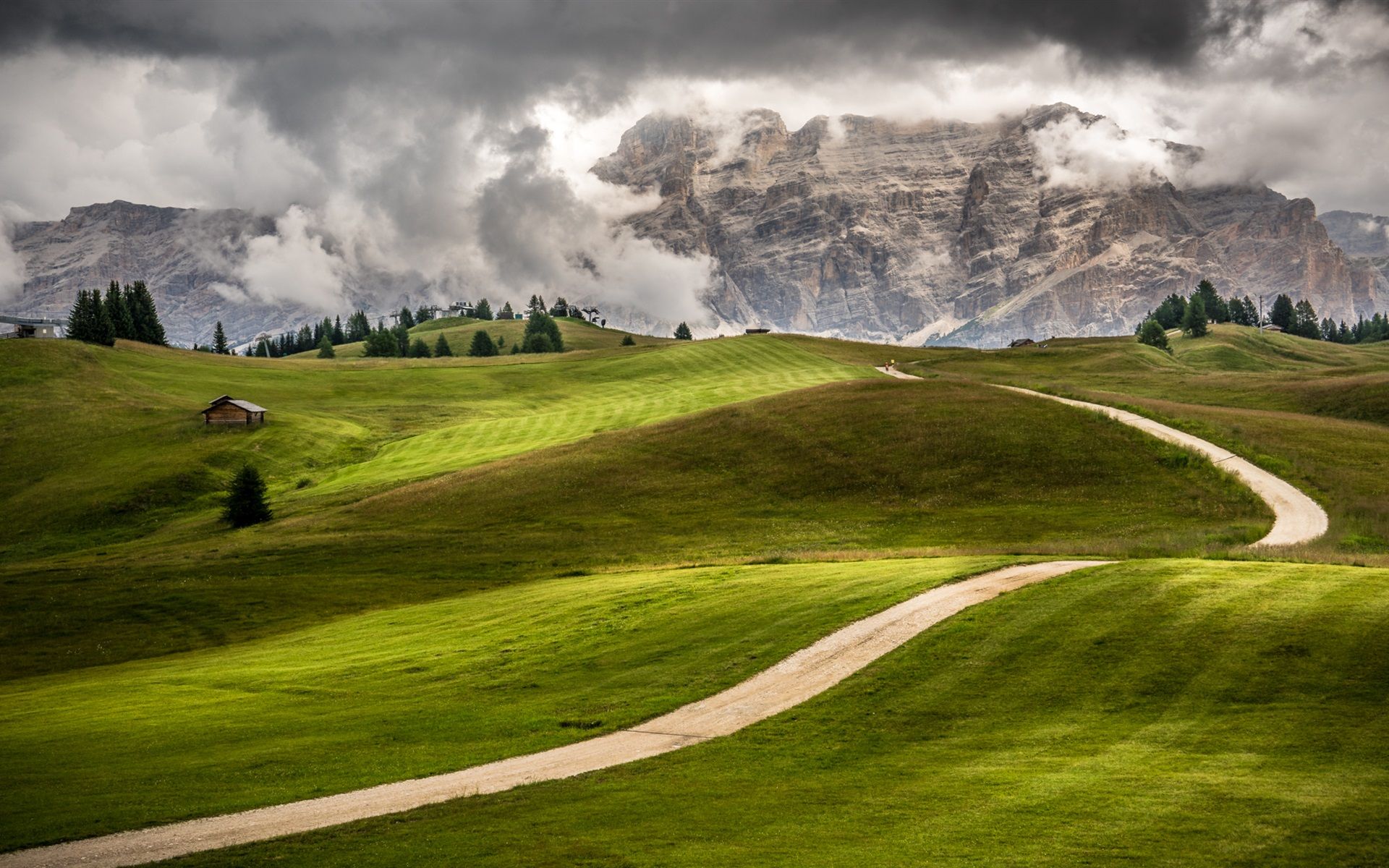 1920x1200 Wallpaper Italy, Trentino, Alto Adige, green fields, mountains, road, trees, house, clouds 1920x1200 Picture, Image