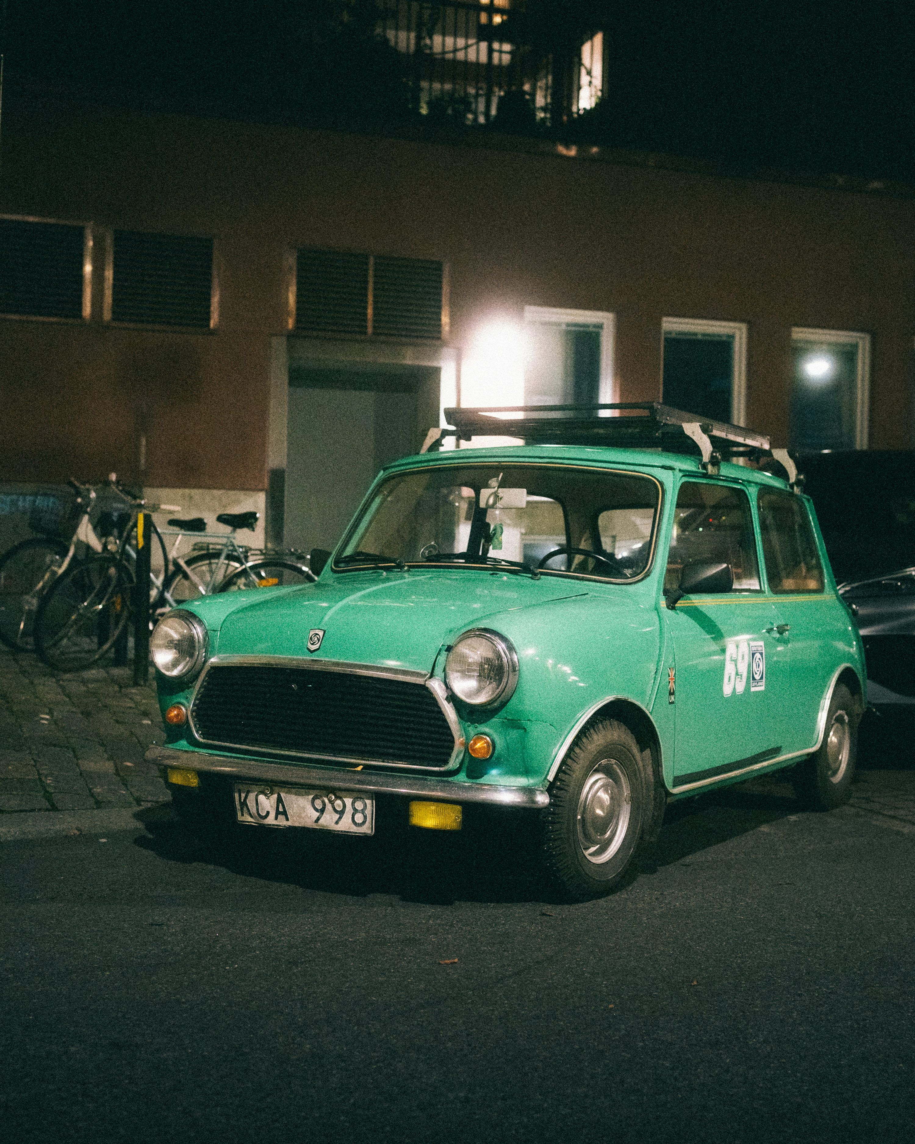 3000x3750 Green vintage mini cooper parked at night photo