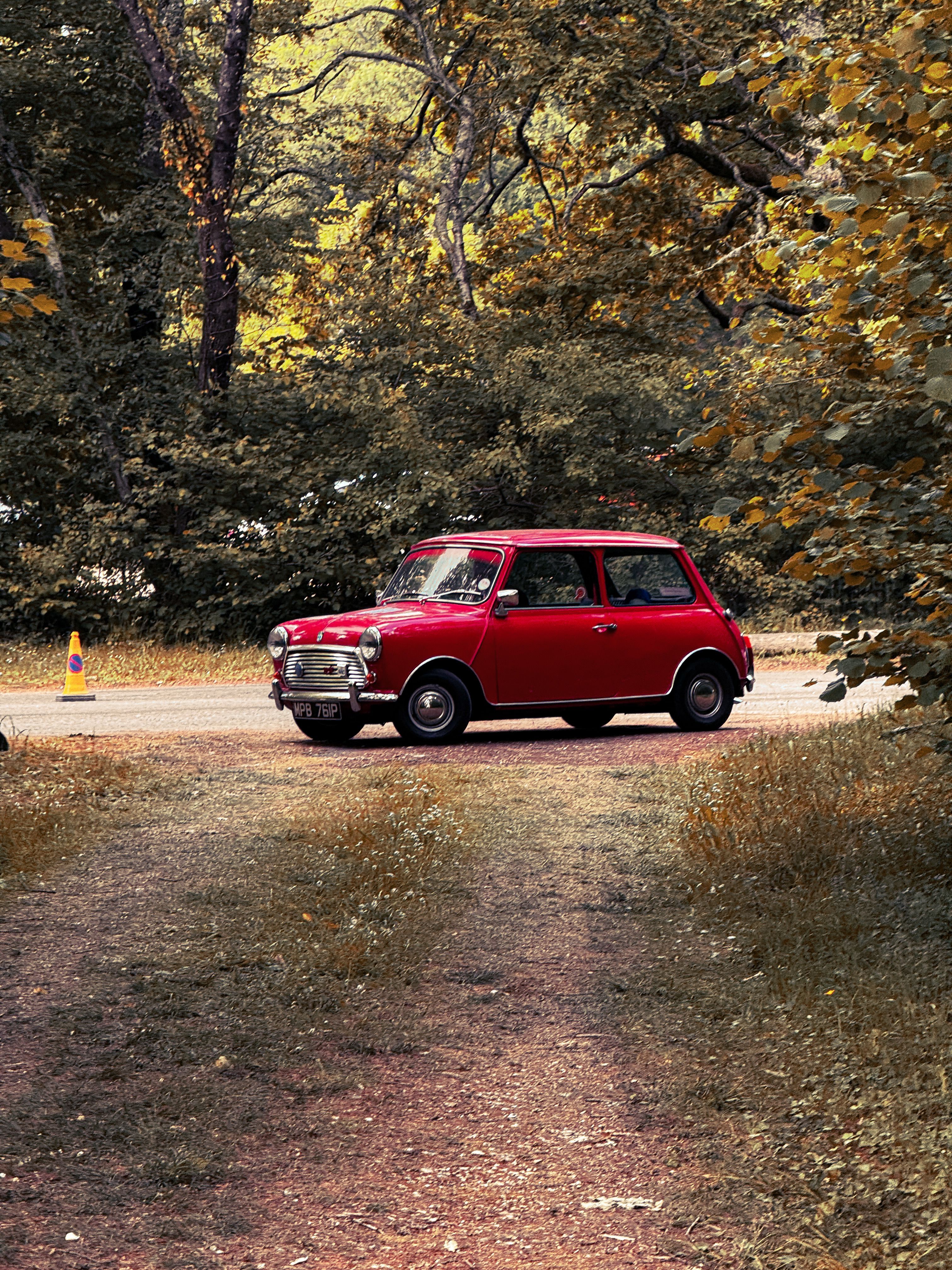 3024x4032 Classic Red Mini Cooper in Autumn Forest · Free