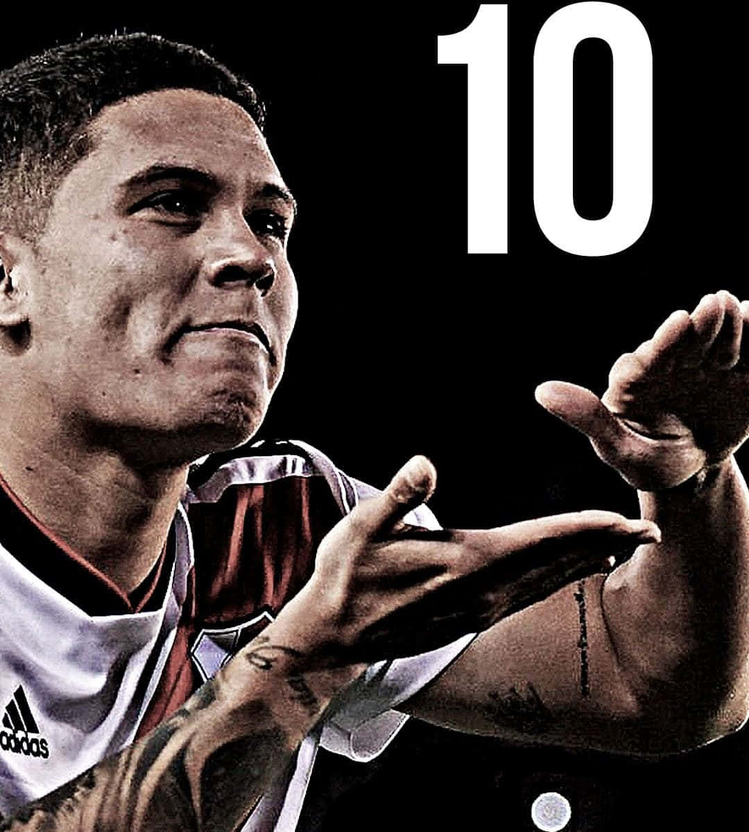 1080x1200 Download Amazing Action Shot of Juan Fernando Quintero in a Football Match Wallpaper
