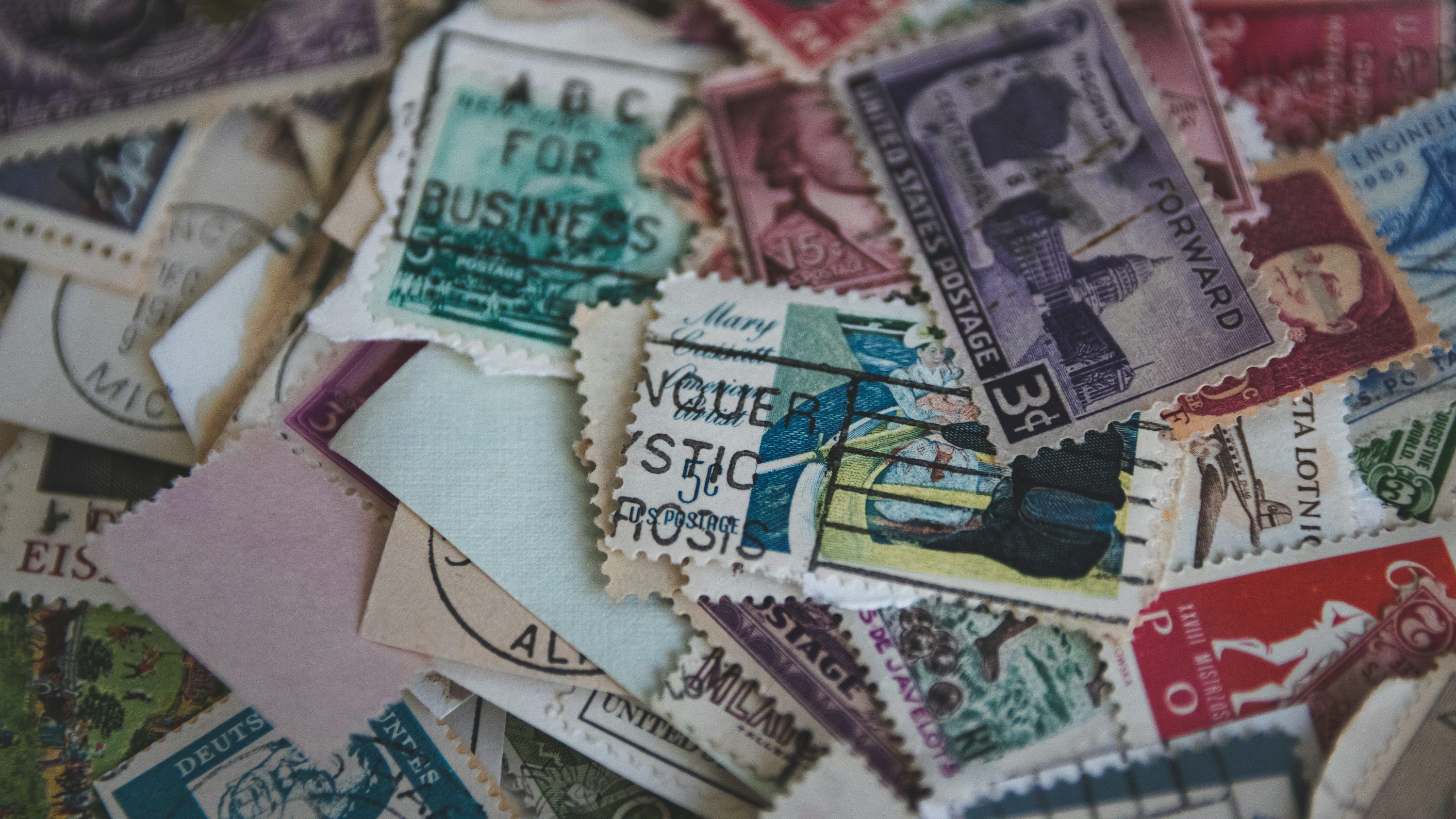 3000x1688 Pile of postage stamps photo