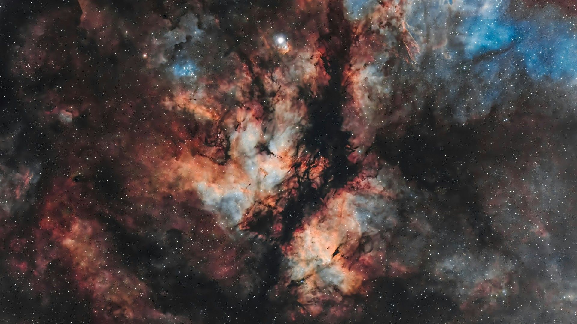 1920x1080 dark dust lanes cuttingth America Nebula revealing vibrant clouds of glowing hydrogen and oxygen in deep space 4K HD space Wallpaper