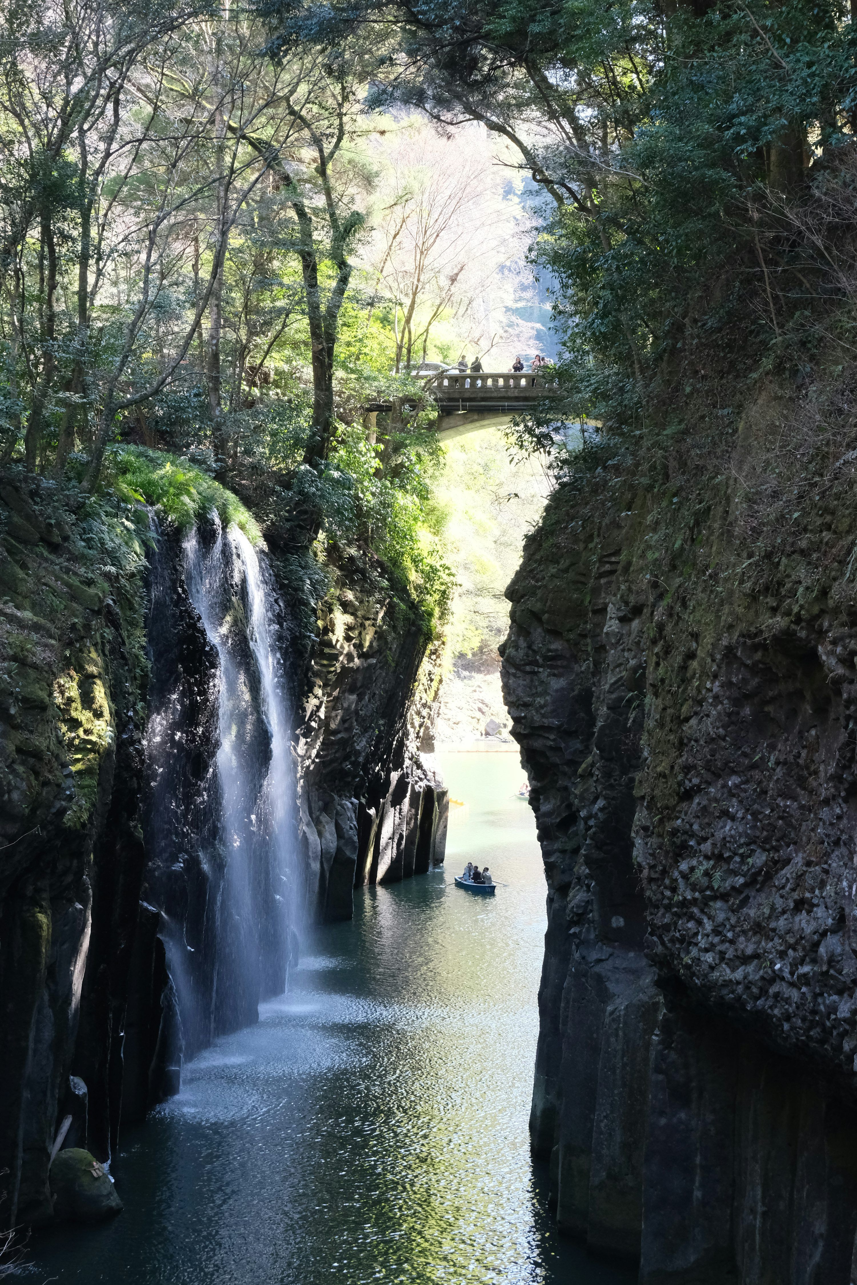 3000x4500 A waterfall in the middle of a river surrounded