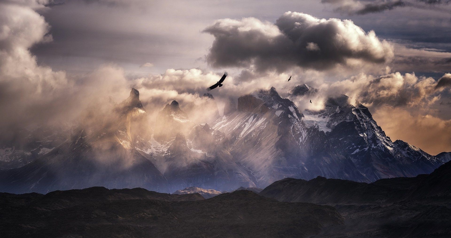 1920x1013 Majestic Andes Mountains with Soaring Bird Beneath Dramatic South American Skyx1080