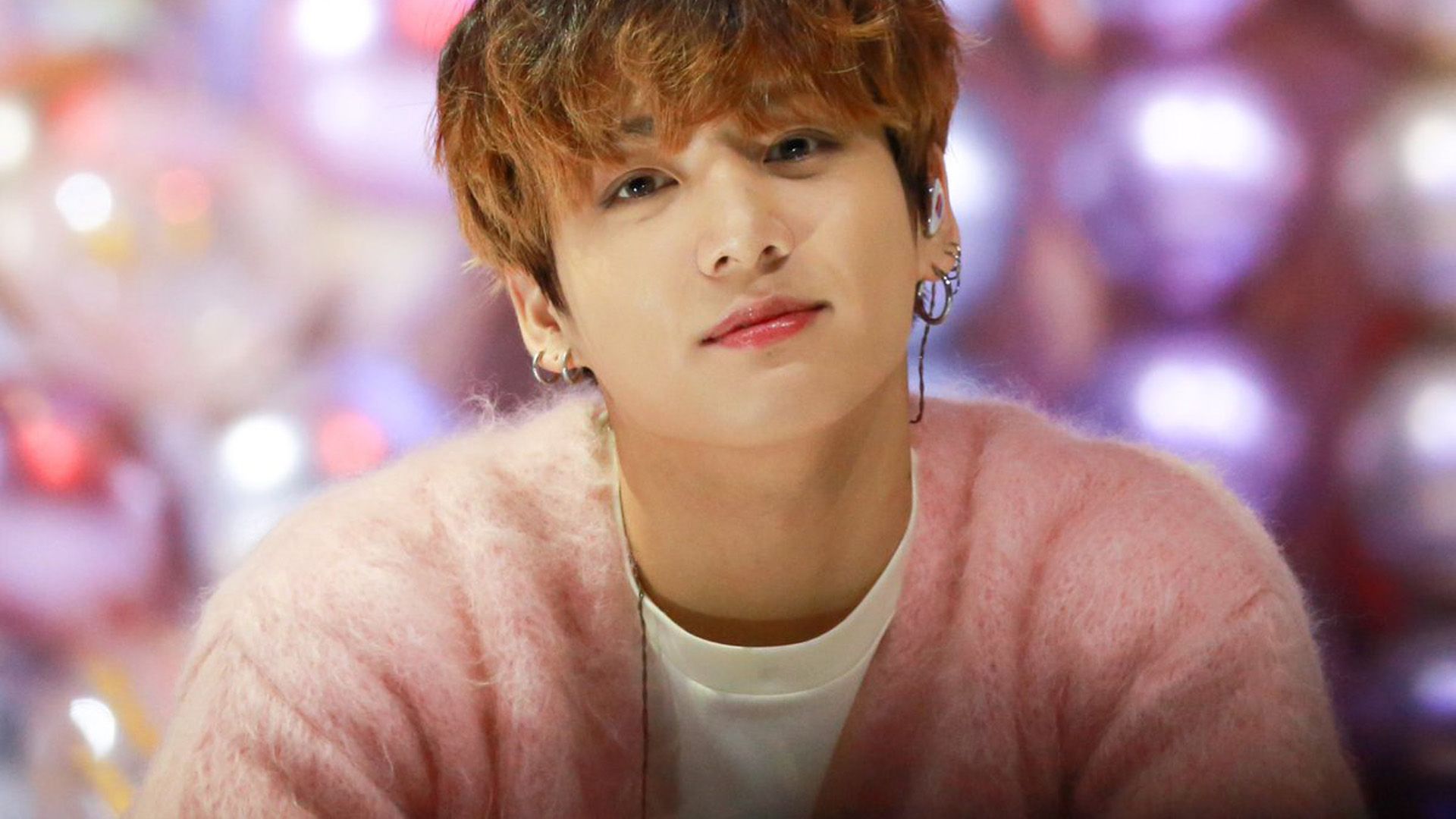 1920x1080 Jungkook Is Wearing White T Shirt And Pink Fur Overcoat Sitting In Glare Lights Bokeh Background HD BTS Wallpaper