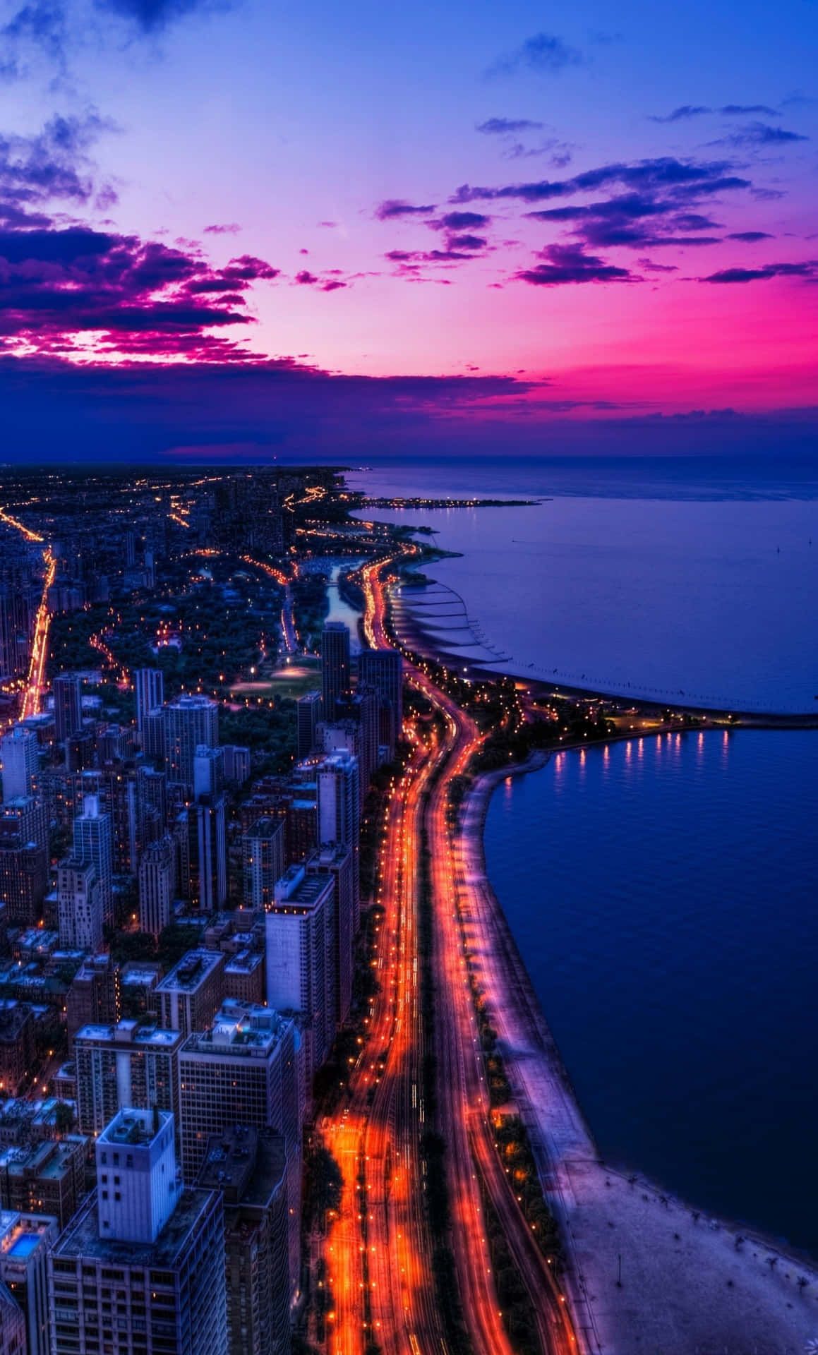 1159x1920 Download Beautiful skyline view of a bustling city during sunset Wallpaper
