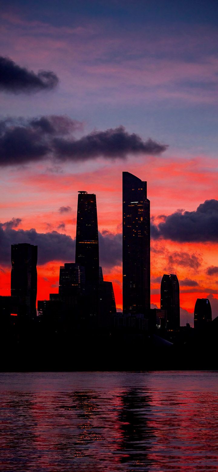 720x1560 Dark city towers at sunset 4K phone Wallpaper