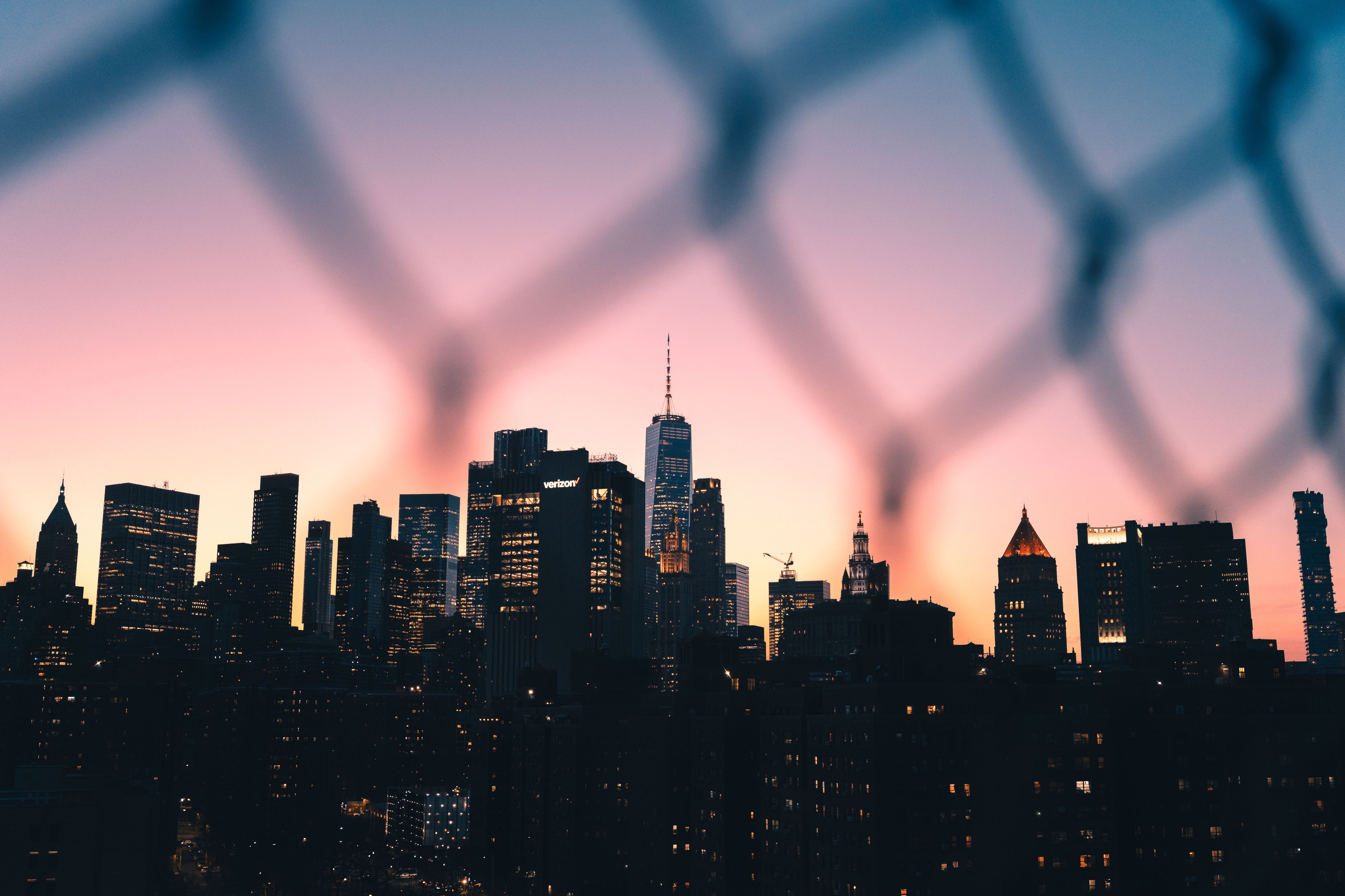 5967x3978 New York City Skyline at Sunset through Fence · Free