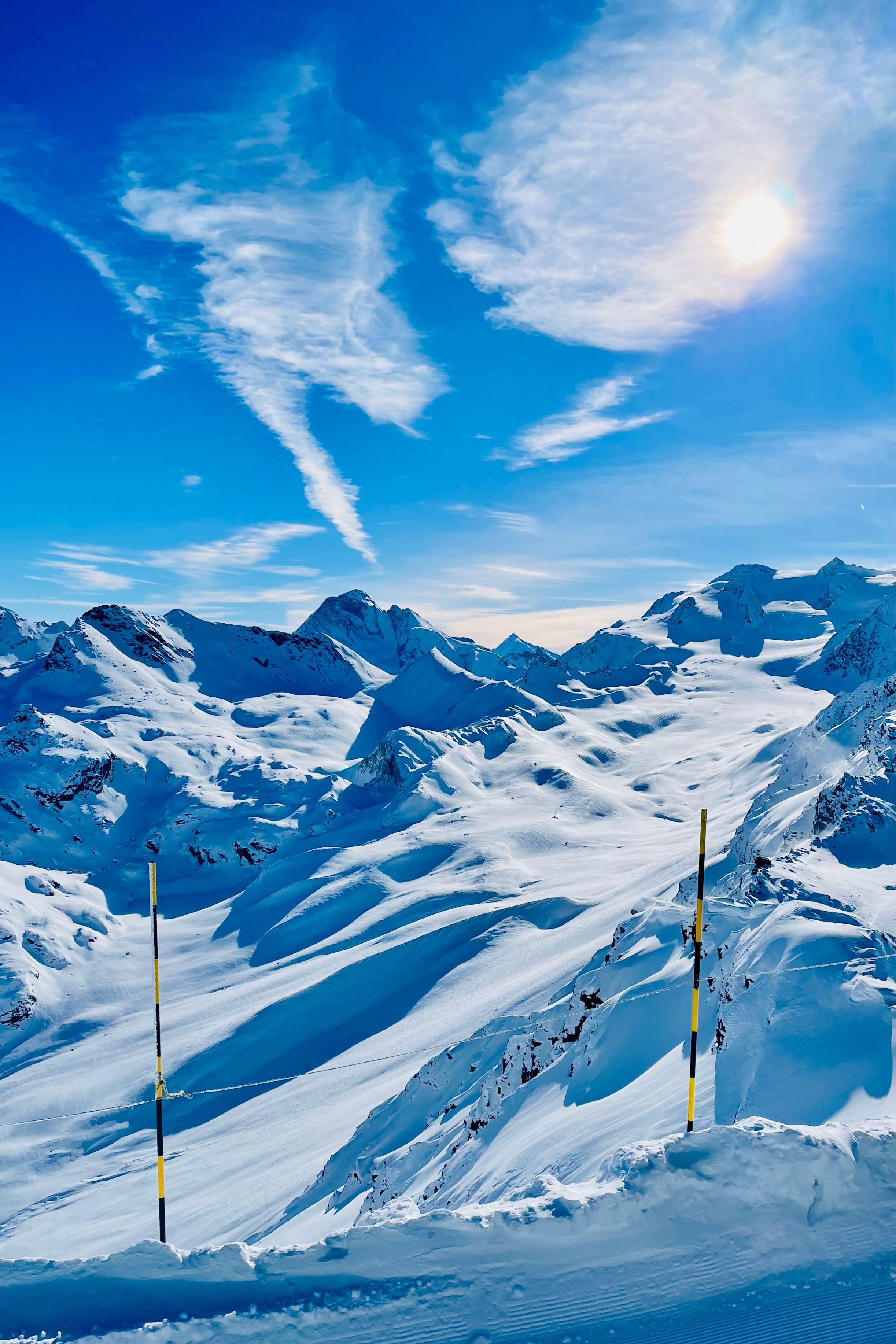 2445x3668 Snow Covered Alpine Mountains Under Bright Sun · Free
