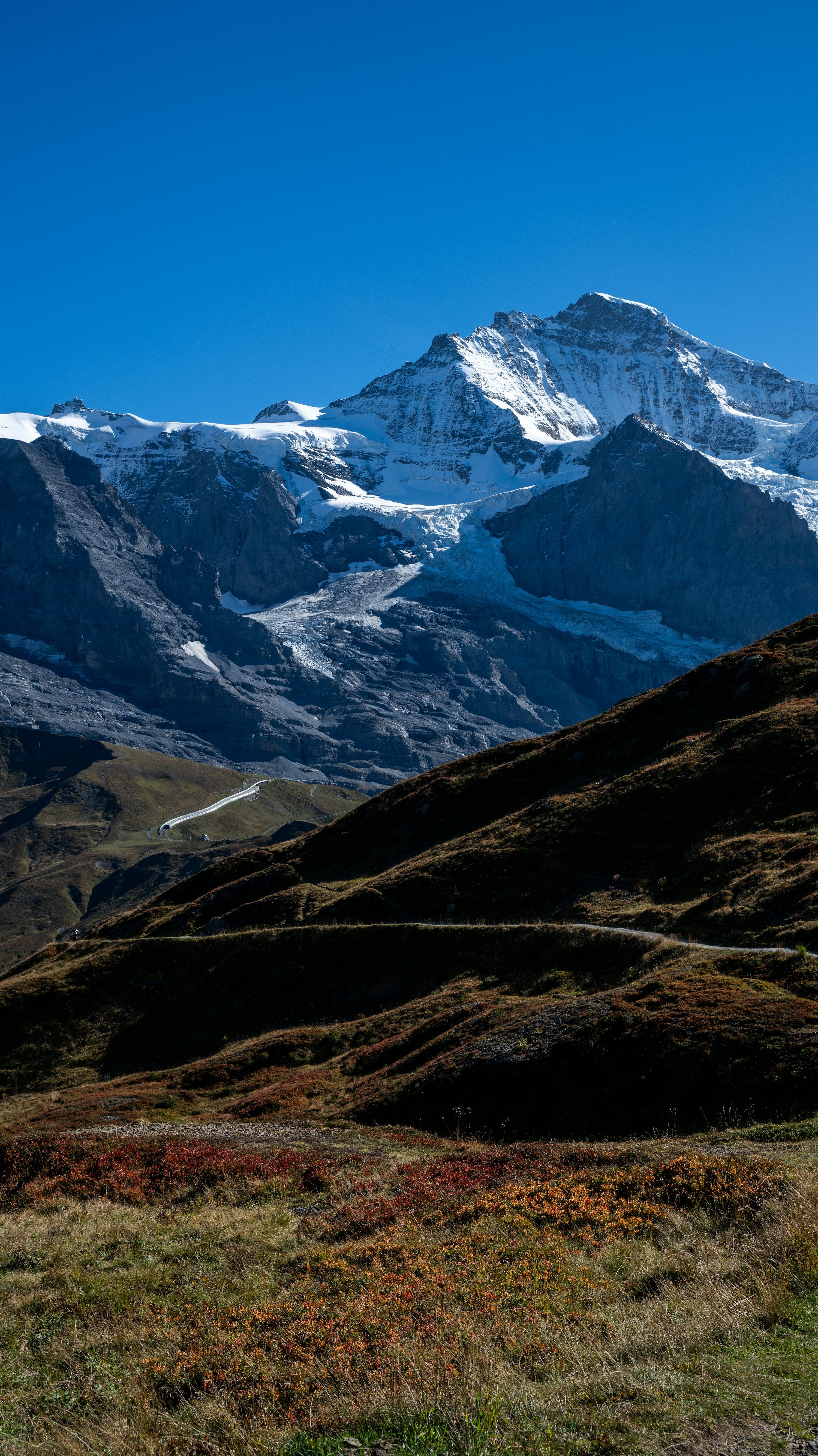 3000x5338 Snow Capped Mountains Under A Clear Blue Sky. Photo
