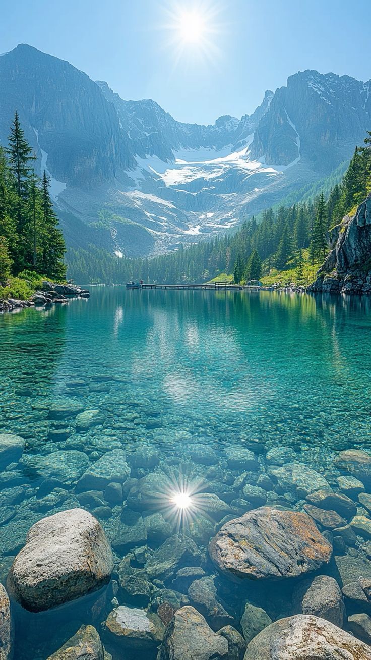 736x1308 Crystal Clear Alpine Lake Wallpaper. Serene Mountain Beauty For Mobile 4K Quality