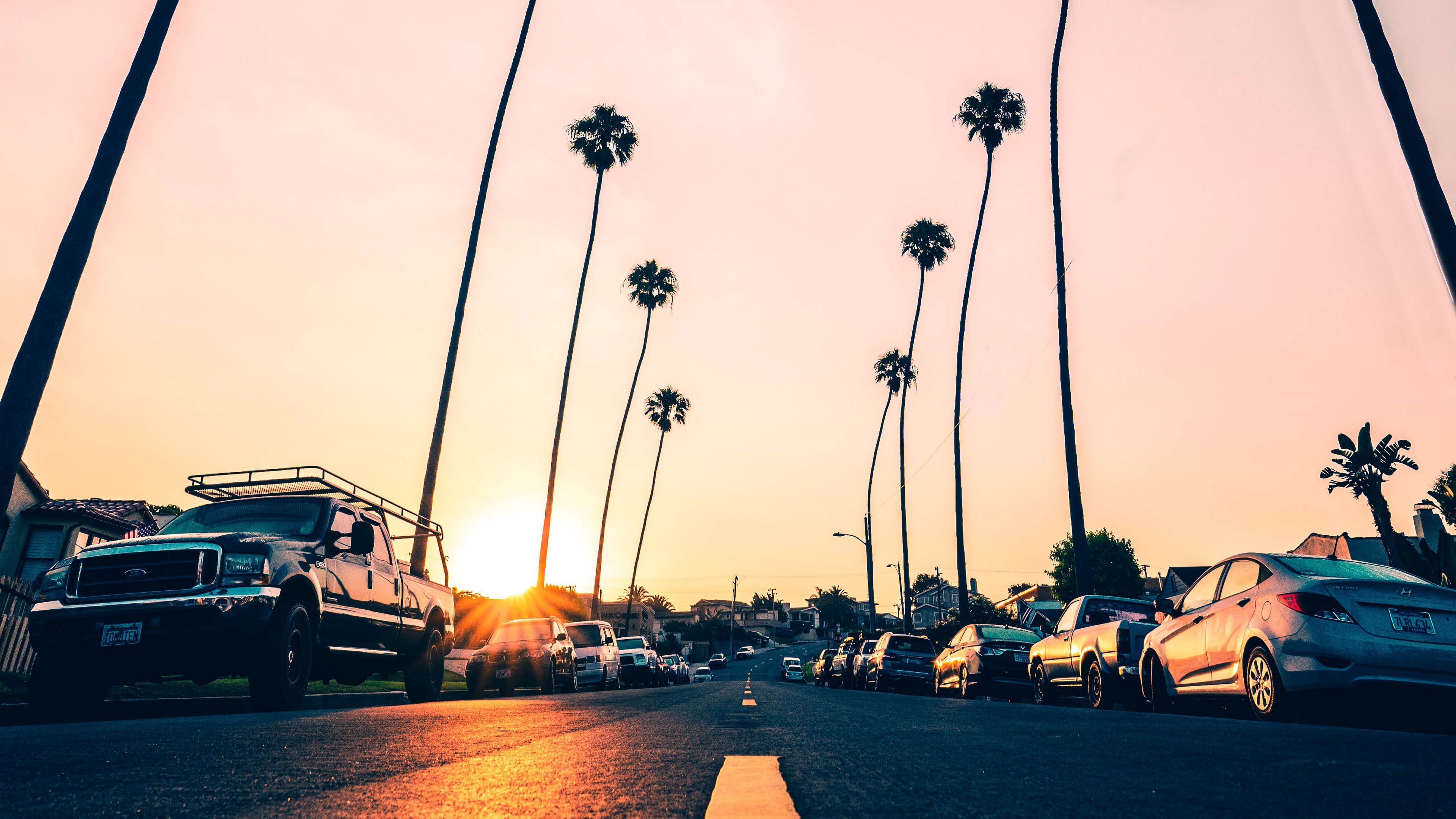 3840x2160 Download wallpaper 3840x2160 road, palm trees, asphalt, cars, marking, redondo beach, california, united states 4k uhd 16:9 HD background