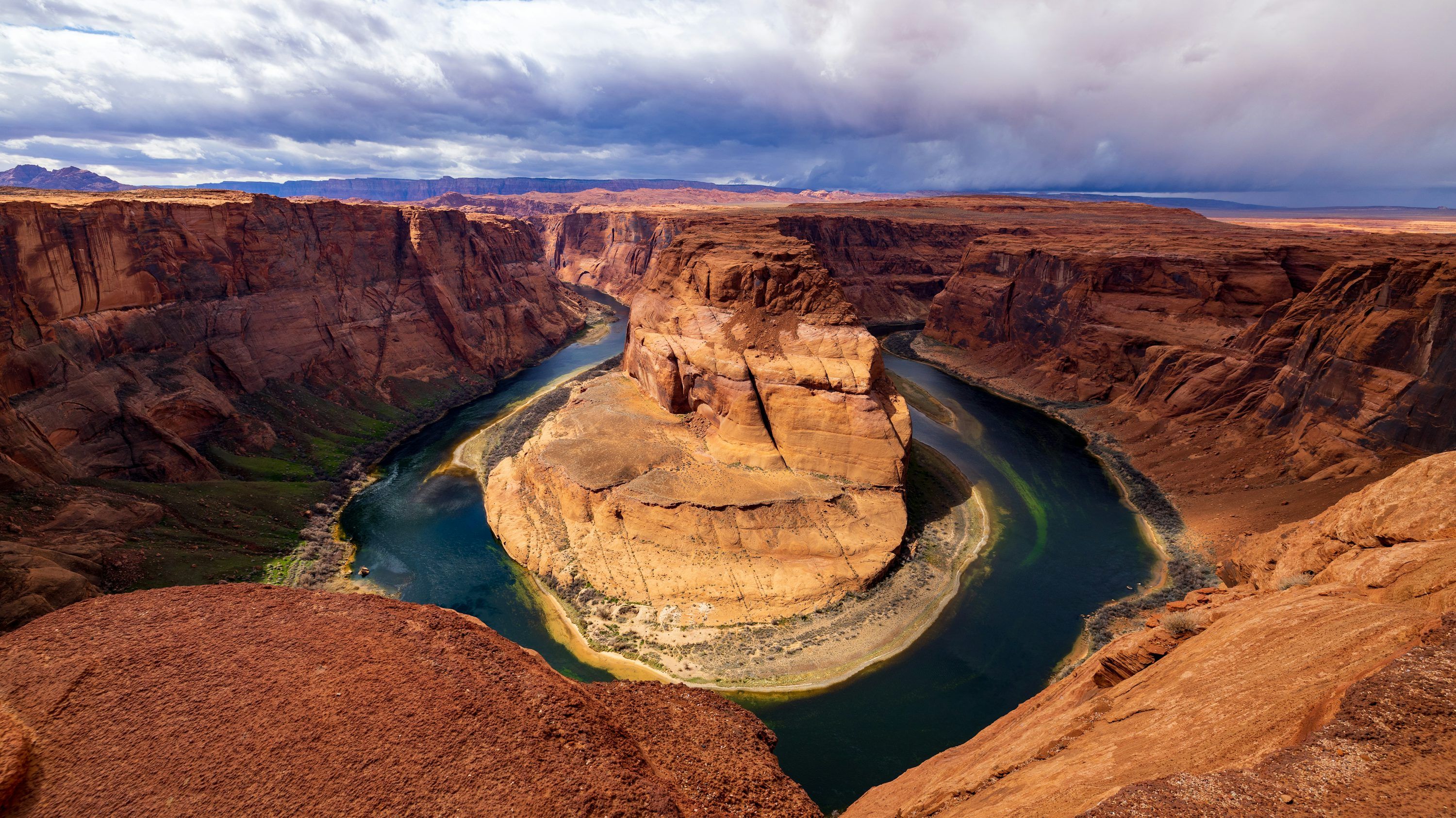 3000x1685 A river flowing through a canyon surrounded
