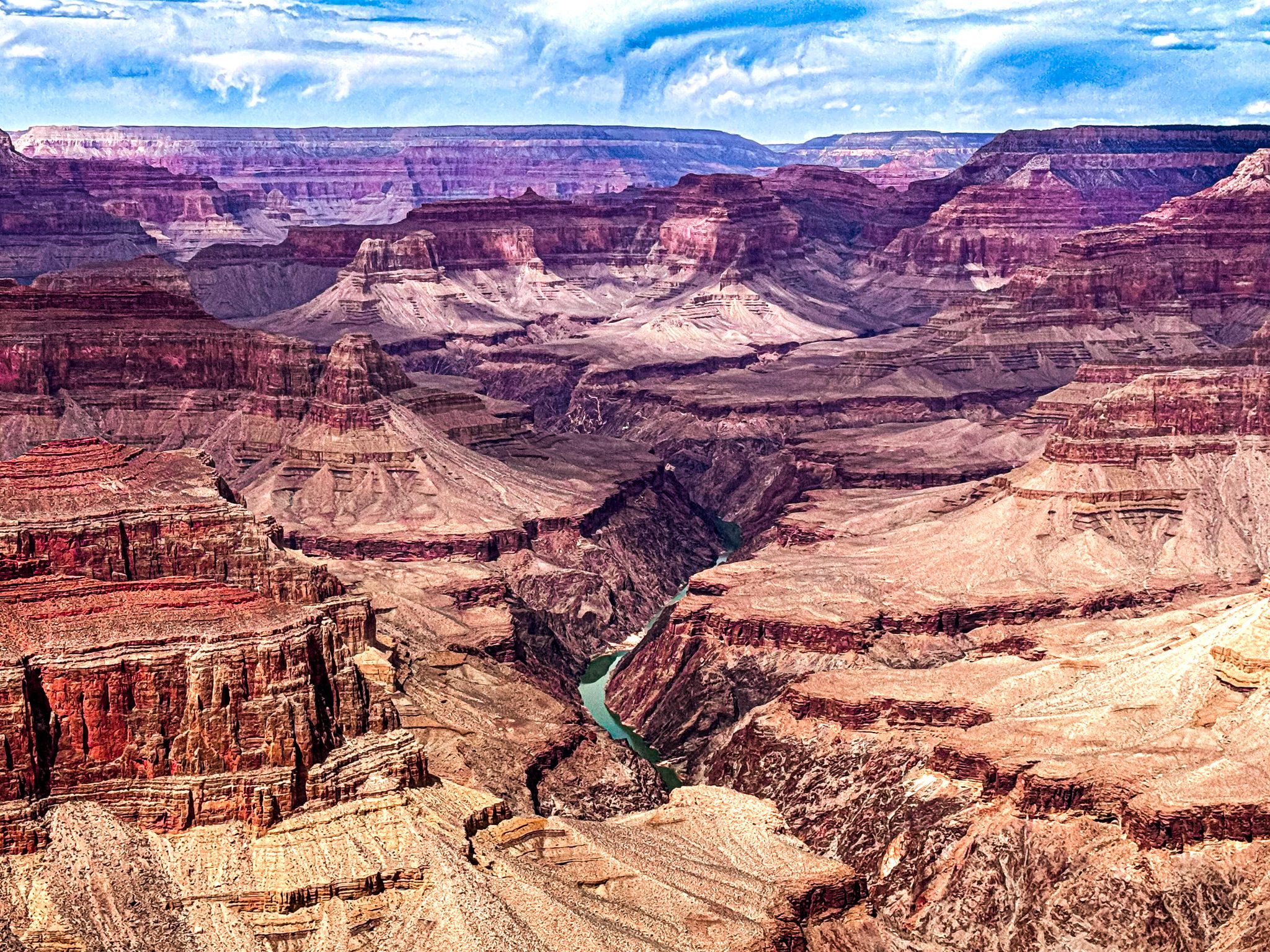 2048x1536 Grand Canyon 1: River Carved Chasm Beneath a Textured Sky