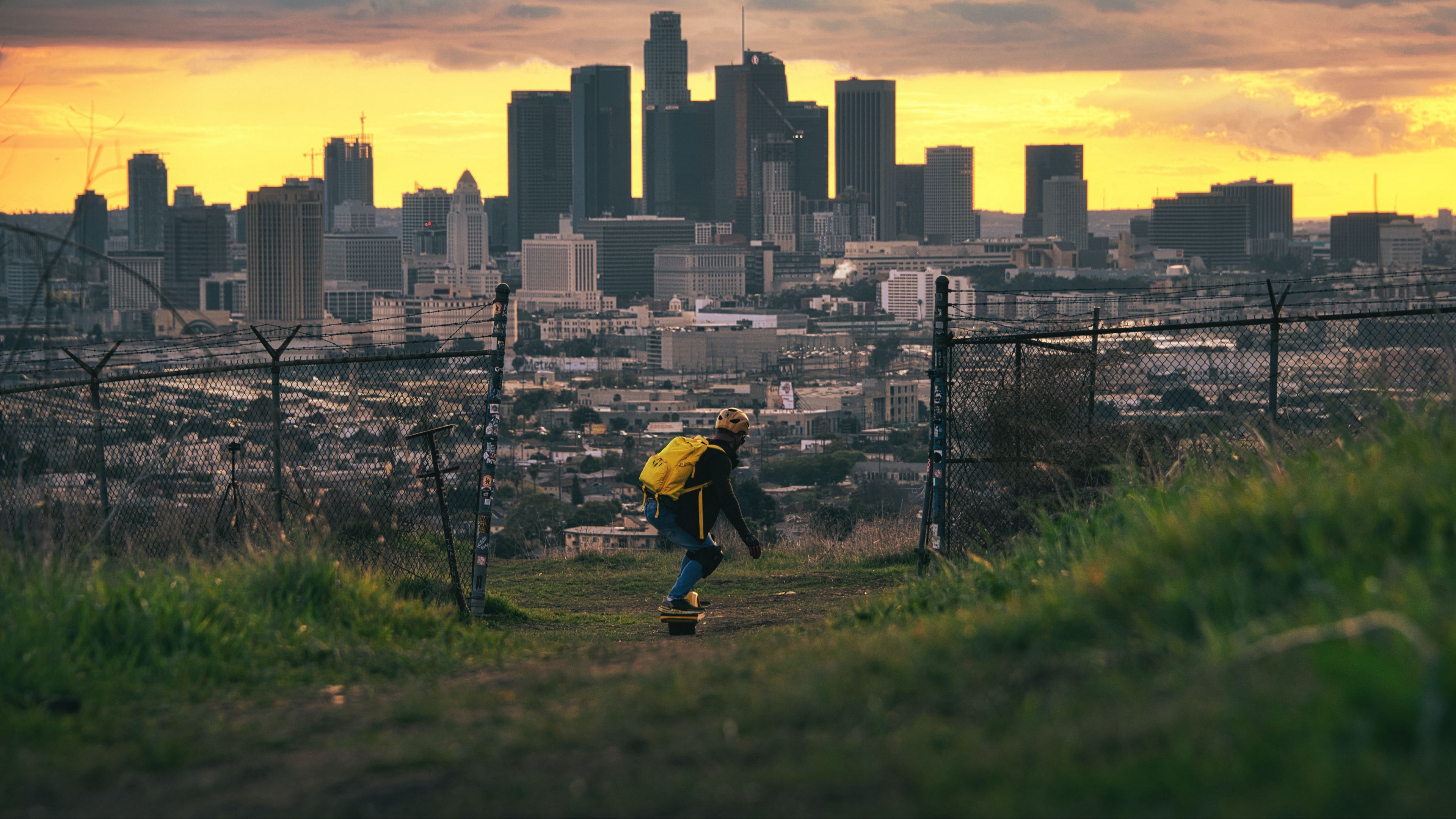3840x2160 Download wallpaper 3840x2160 skater, skate, city, buildings, view 4k uhd 16:9 HD background