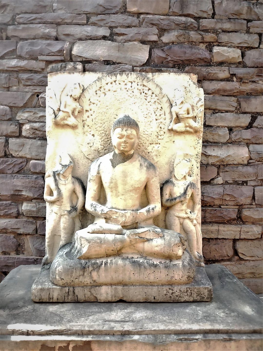 1080x1440 Seated Buddha statue at Sanchi Stupa commissioned by the emperor Ashoka in the 2nd century BCE