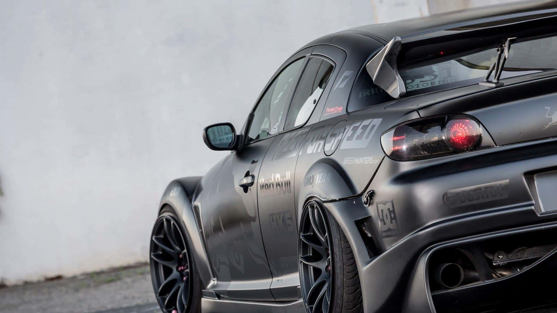 1920x1080 Download Sleek Red Mazda RX 8 Sportscar Showcasing Performance And Style Wallpaper