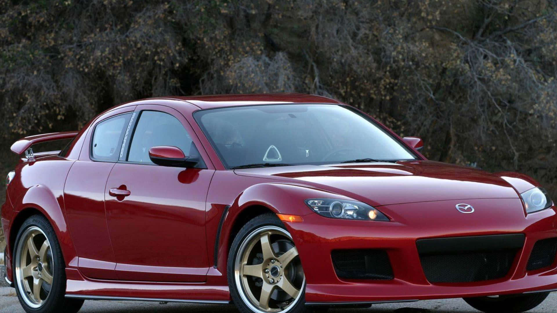 1920x1080 Download Sleek Red Mazda RX 8 Sportscar In Scenic Driveway Wallpaper