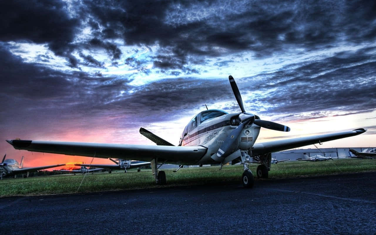 1280x800 Download Sunset Beechcraft Bonanza Small Plane Background