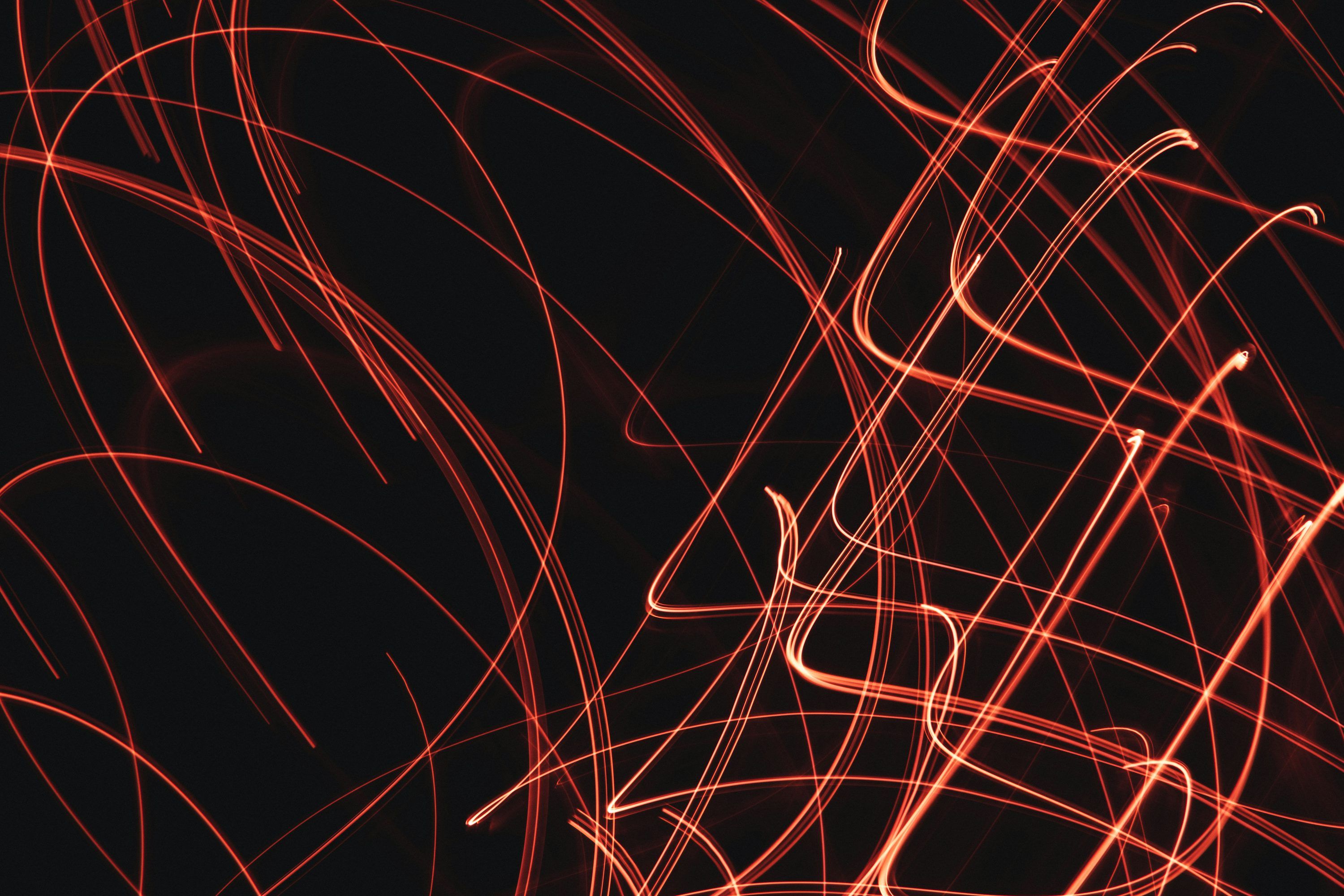 3000x2000 A black background with red lines in it photo