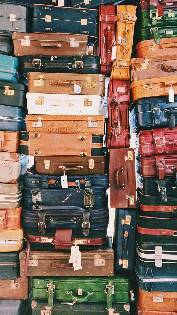 750x1334 pile of luggages iPhone 8 Wallpaper Free Download