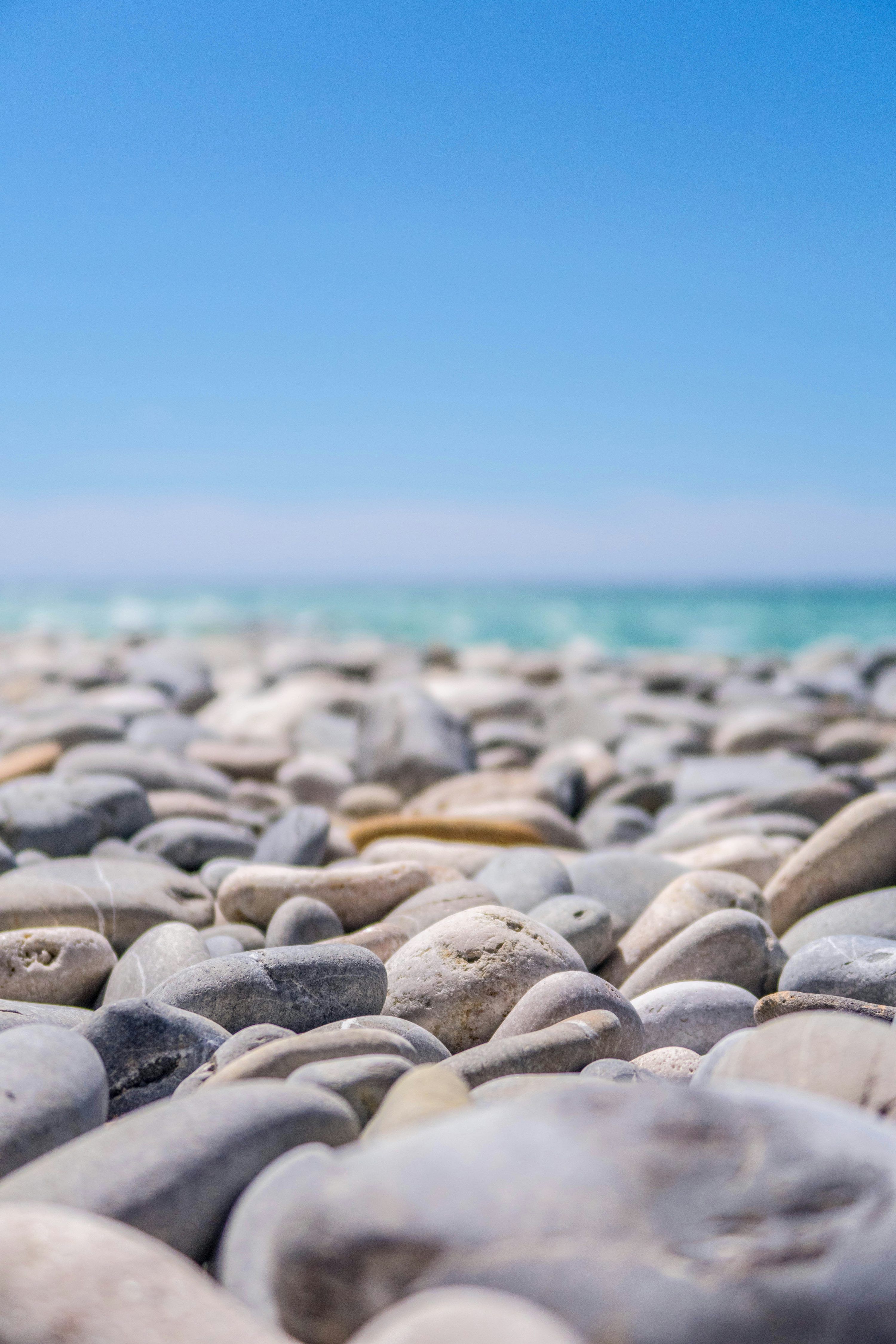3000x4500 Gray pebbles near body of water photo