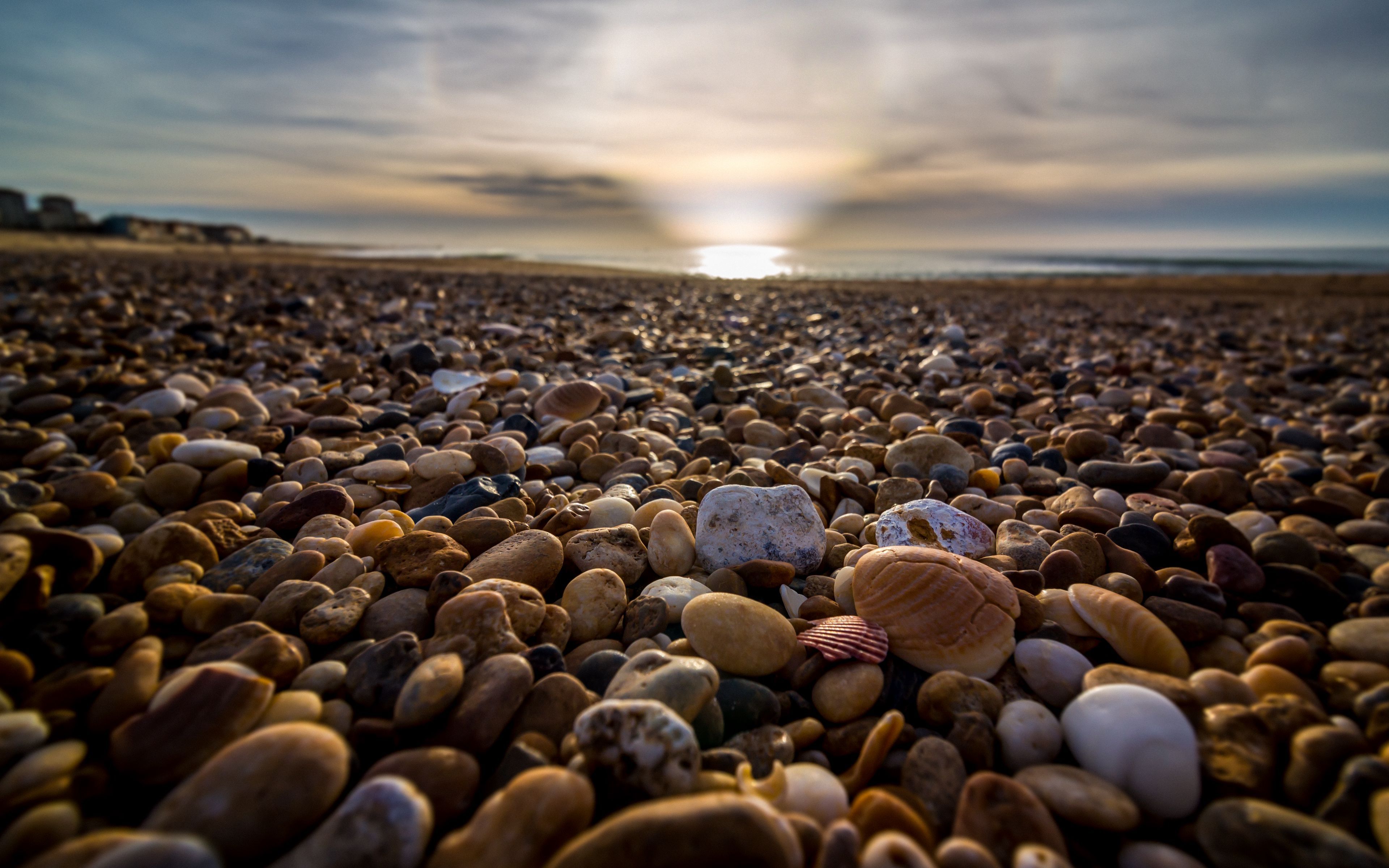 3840x2400 Download wallpaper 3840x2400 beach, pebbles, sea, stones, sky, rays 4k ultra HD 16:10 HD background