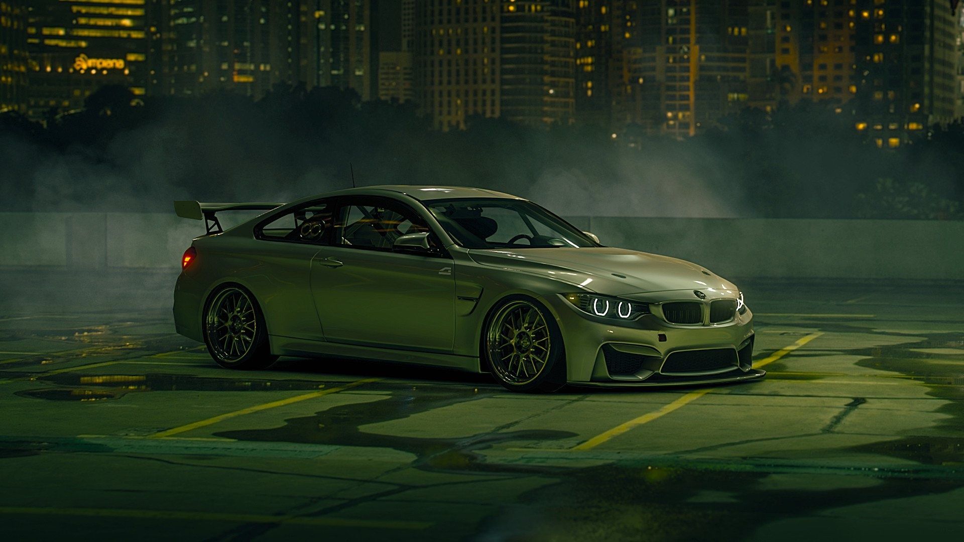 1920x1080 Green BMW M4 Power Stance on Urban Nighttime Background