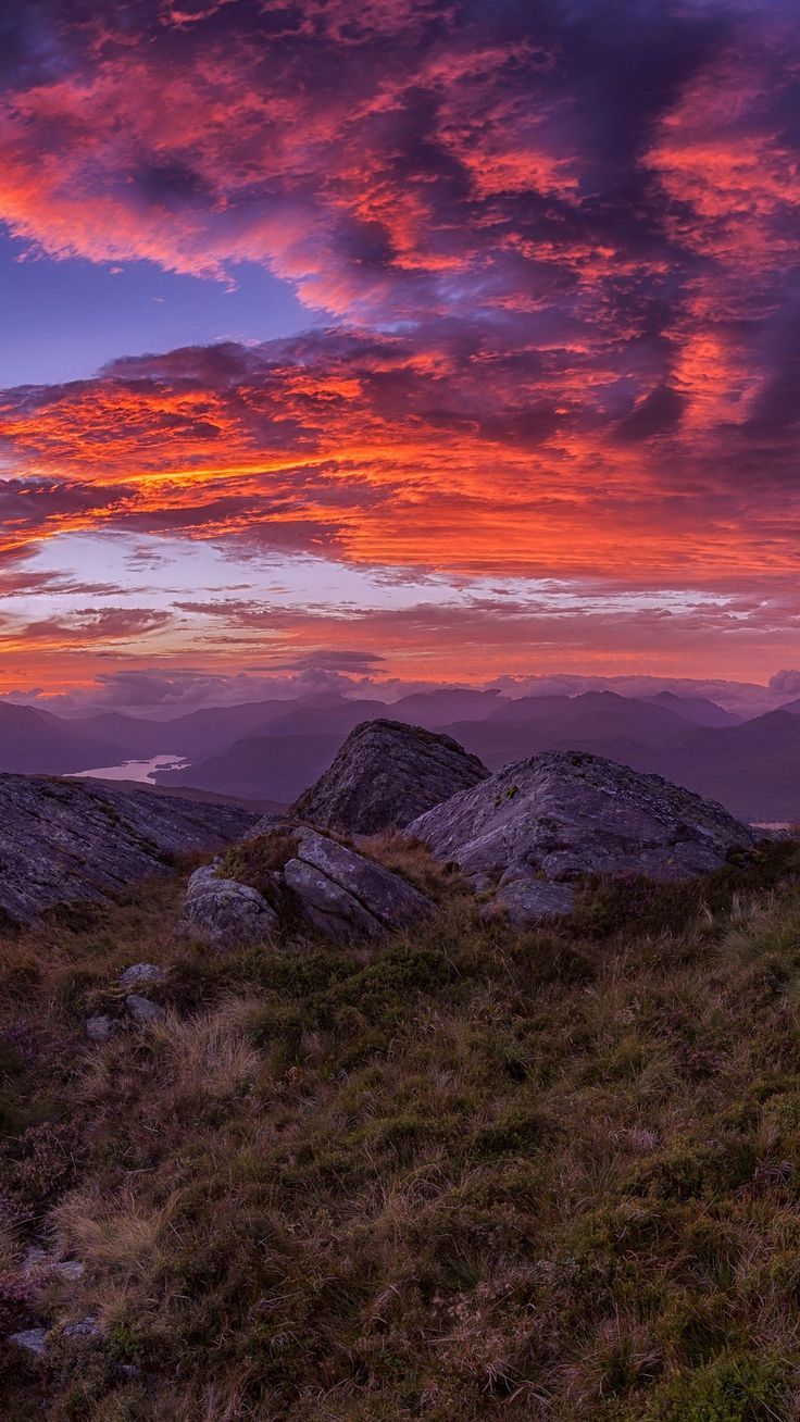 736x1308 Mountains, sunset, stones, grass, clouds, landscape wallpaper