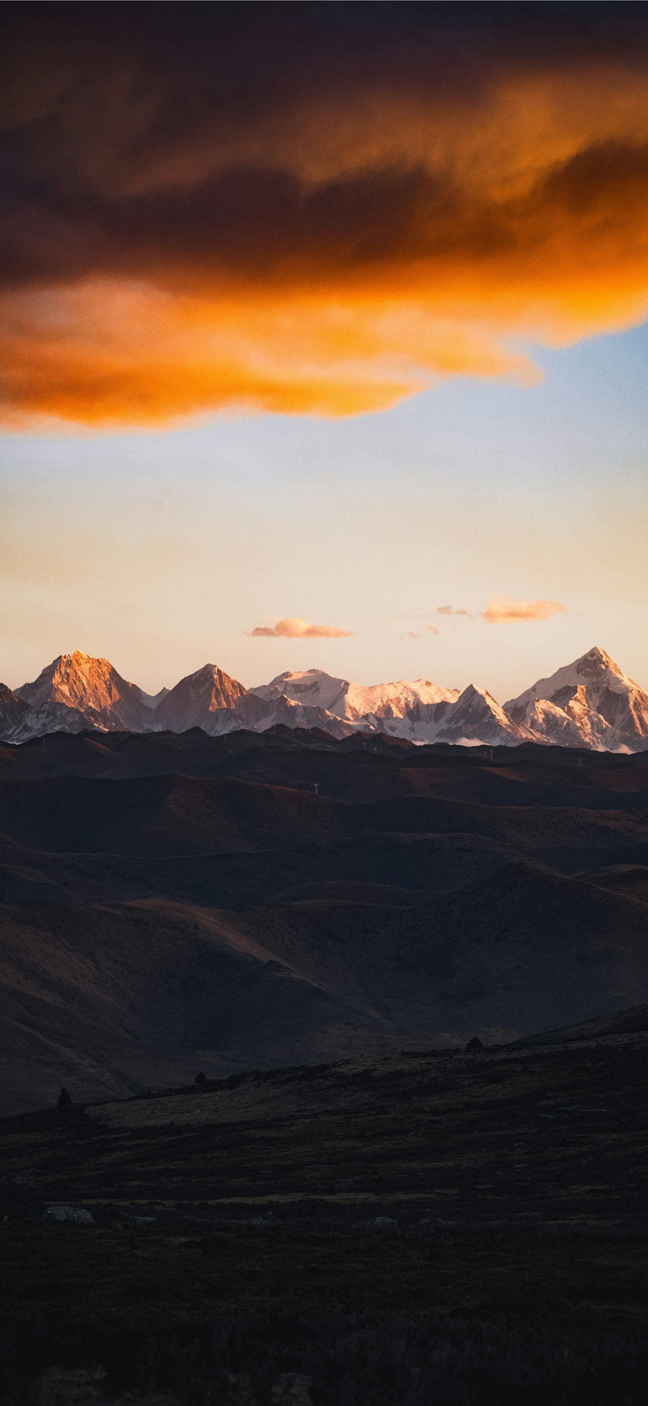 1290x2796 A view of a mountain range at sunset iPhone Wallpaper Free Download