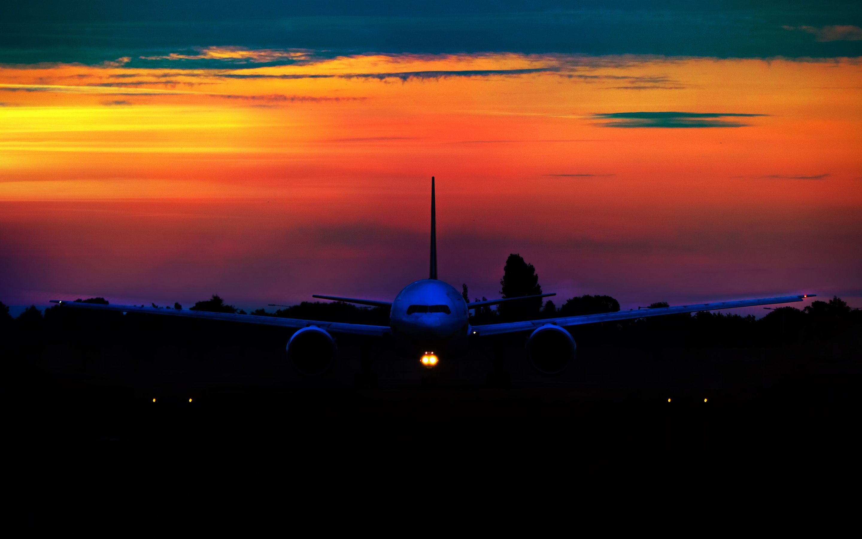 2880x1800 Wallpaper Airplane at sunset, front view, night 3840x2160 UHD 4K Picture, Image