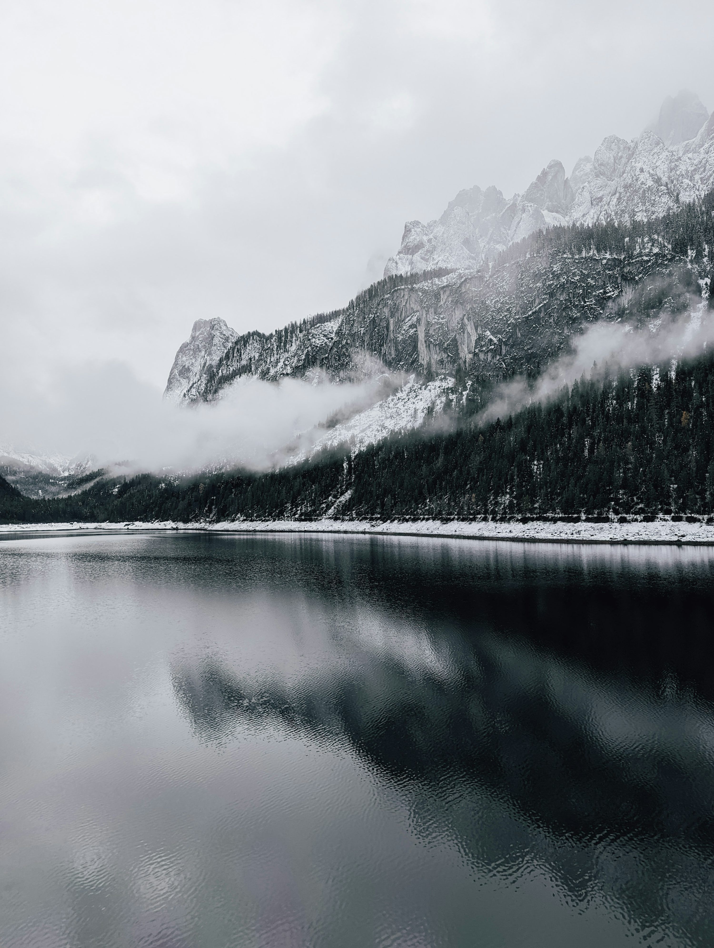 3000x3984 A lake with trees and mountains in the background photo