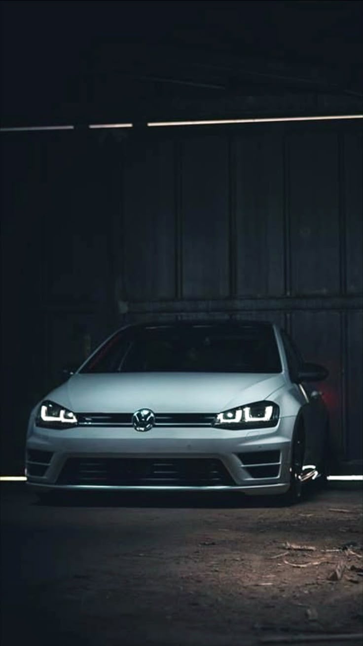 736x1308 Volkswagen Logo on Silver Car. Volkswagen gti dark mode, Mk5 gti wallpaper iphone, Car iphone