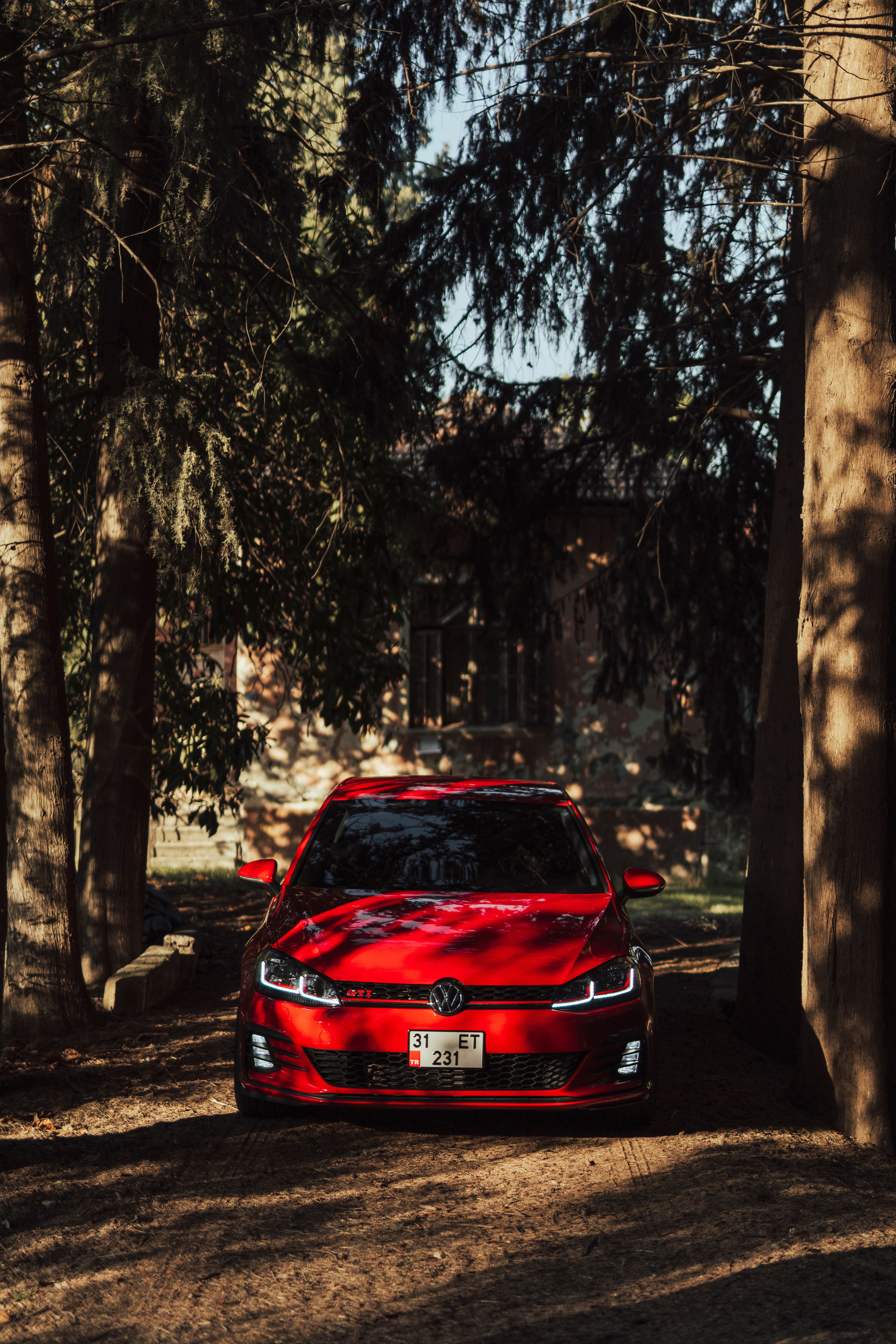 5660x8490 Red Volkswagen Golf GTI in Forest Setting · Free