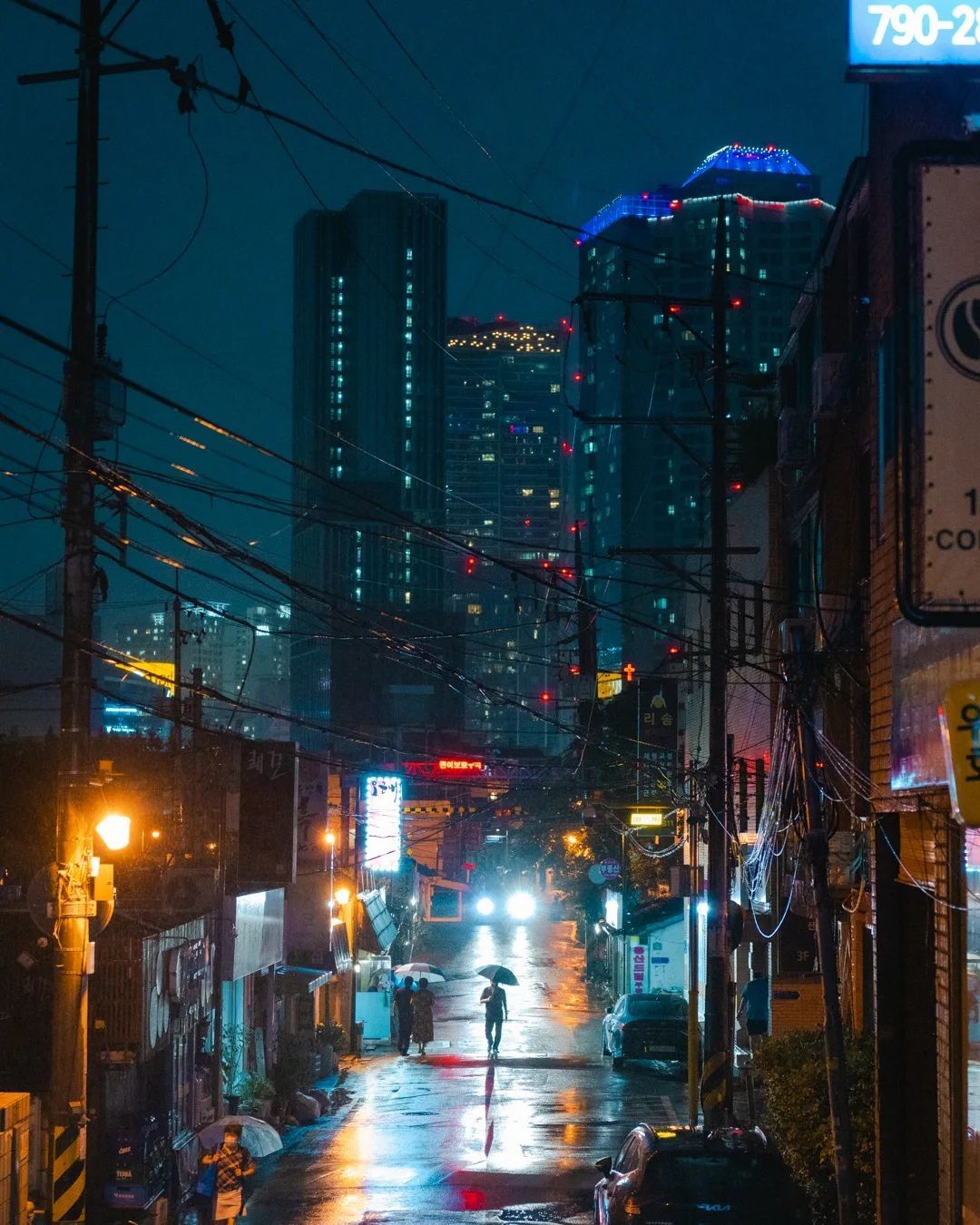 1080x1350 Rain Soaked Alley With Messy Overhead Cables In Yongsan District, Seoul, South Korea
