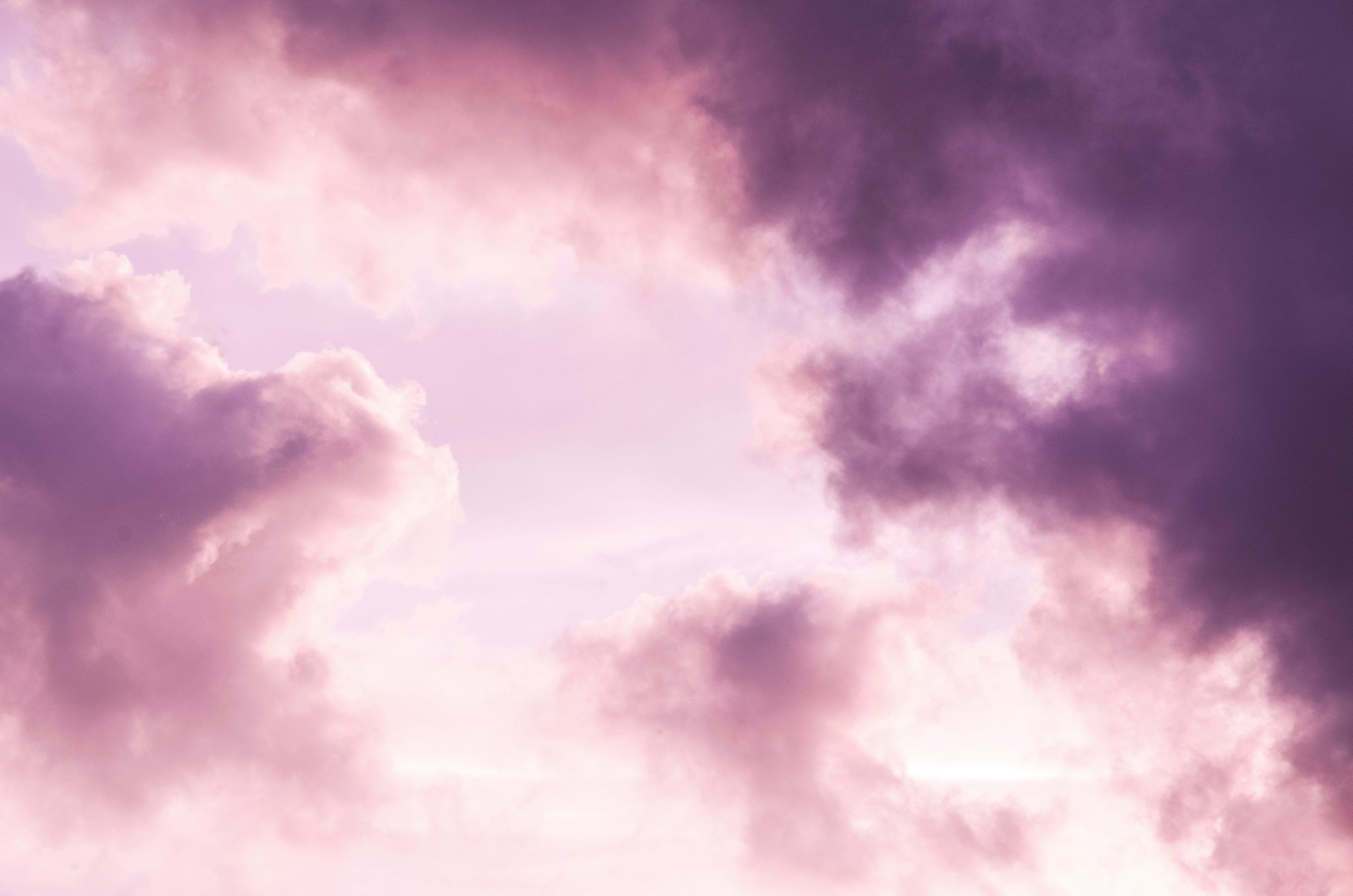 3000x1987 Pink and purple clouds against a light sky photo
