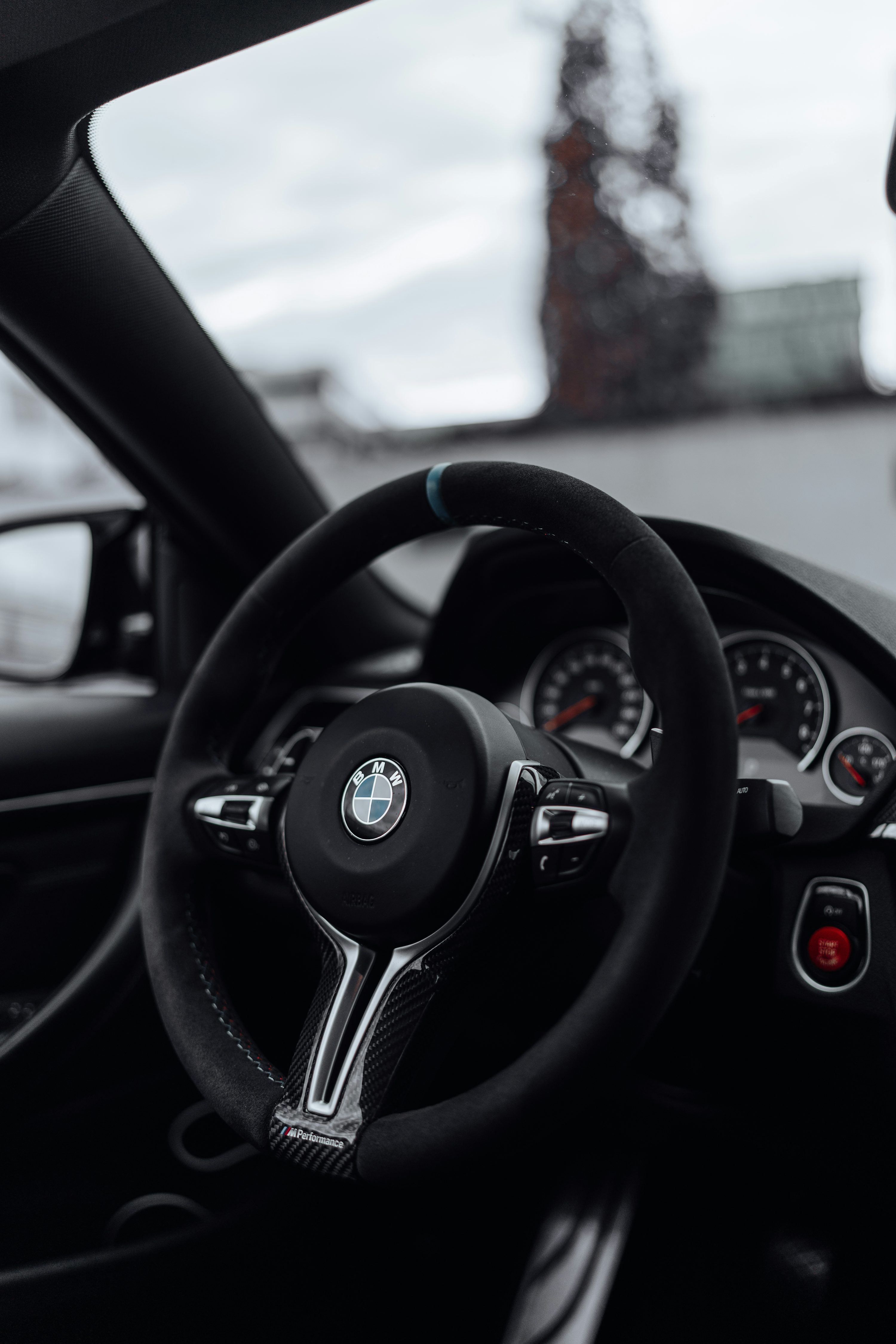 3000x4500 A steering wheel and dashboard of a car photo