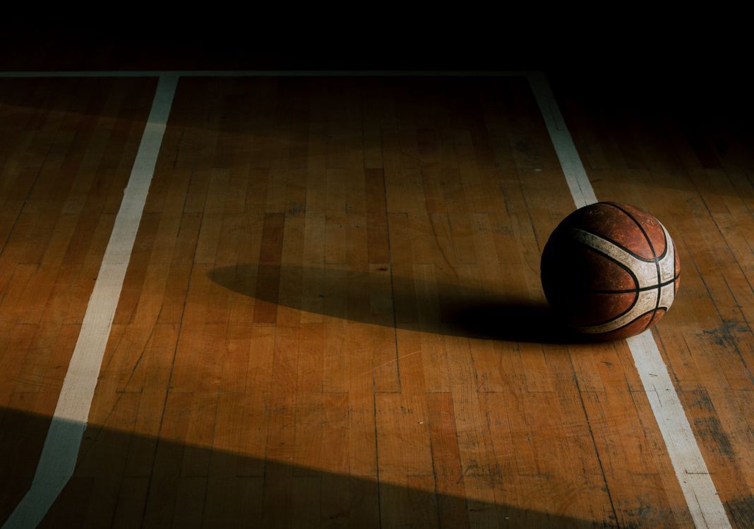 1068x750 Ball on an Empty Basketball Court · Free