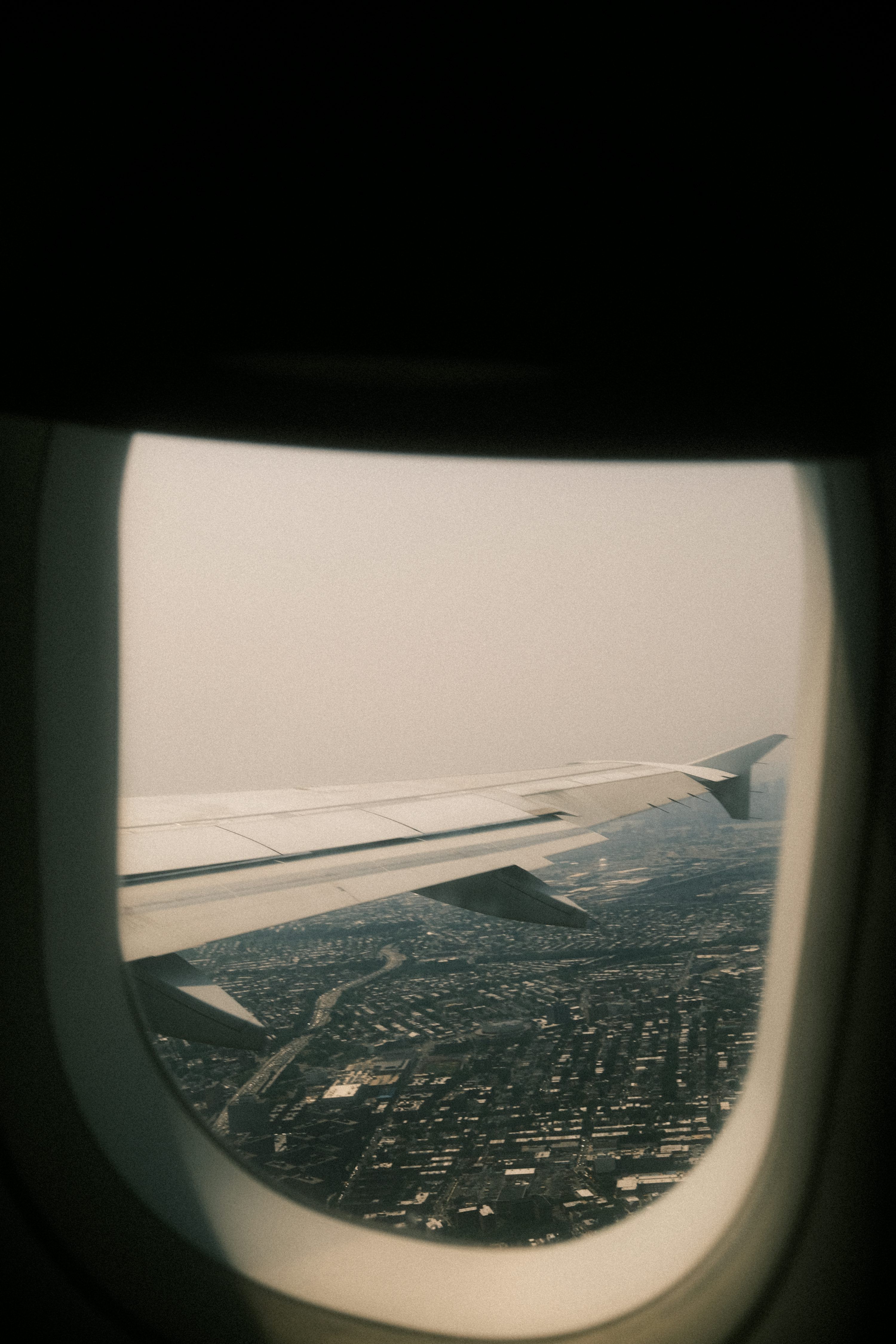 3000x4500 A view of a city from an airplane window photo