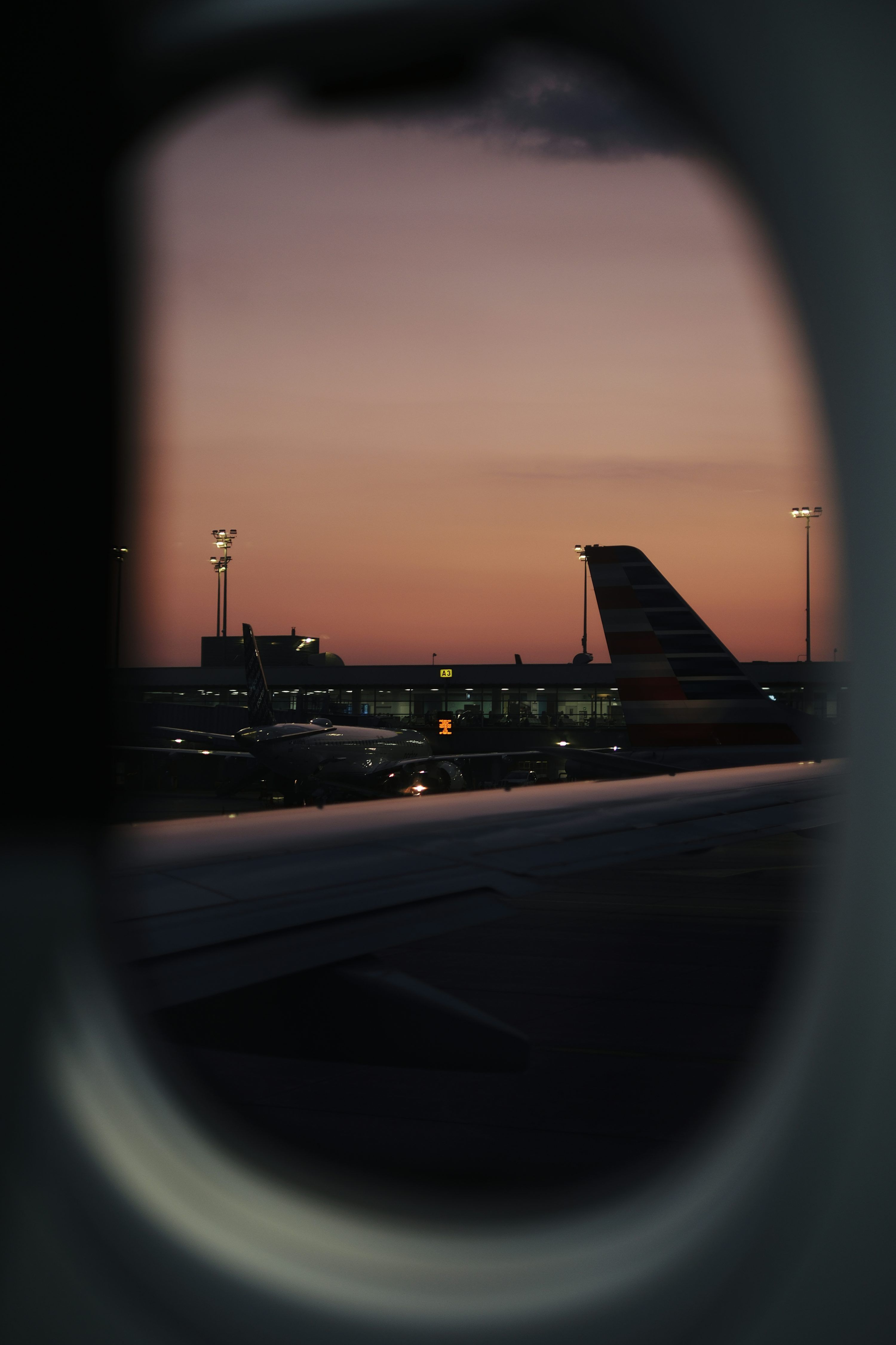 3000x4500 Sunset airport view from an airplane window. photo