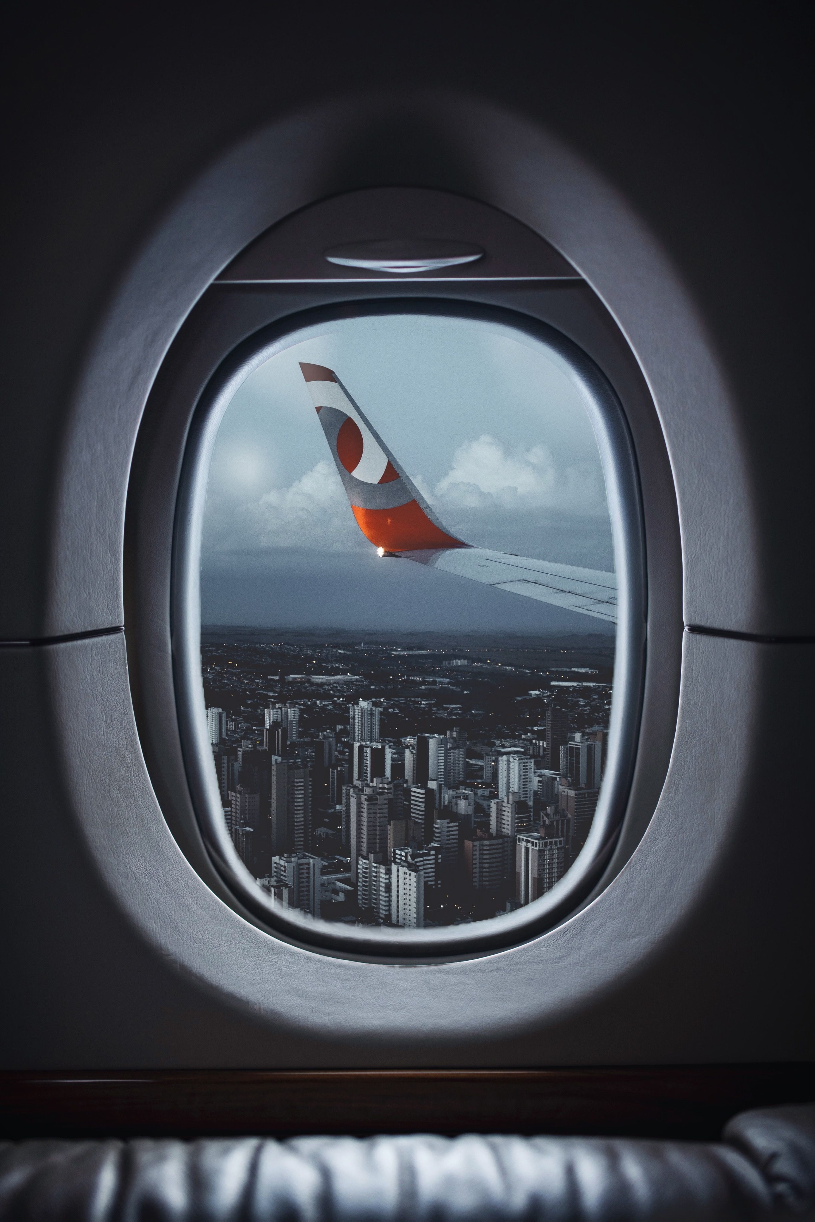 2733x4096 Airplane Window View of City Buildings · Free