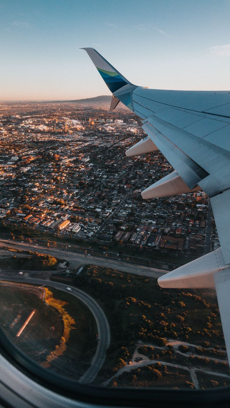 800x1420 Download Wallpaper 800x1420 Airplane, Wing, City, Aerial View, Overview Iphone Se 5s 5c 5 For Parallax HD Background