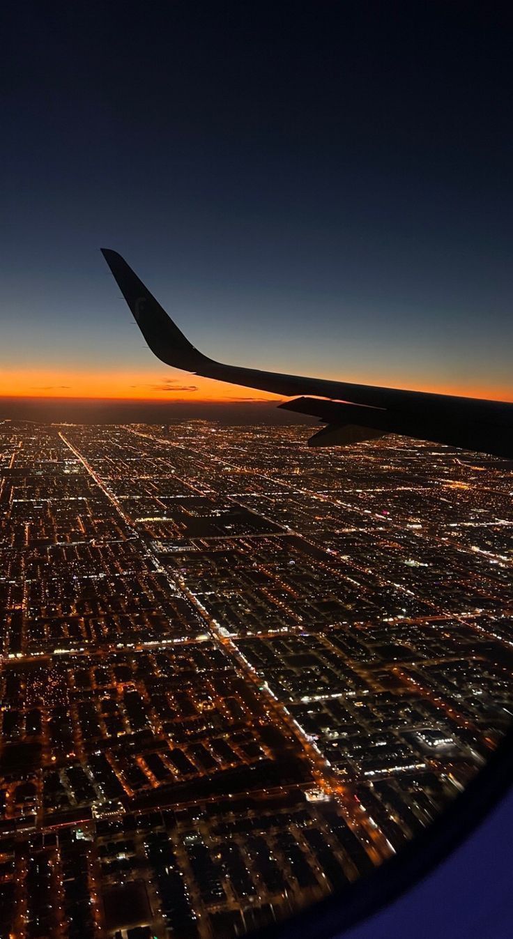 736x1347 Airplane Wing Flying Over City at Sunset. Aesthetic picture airplane, Aesthetic aeroplane picture, Aesthetic wallpaper airplane