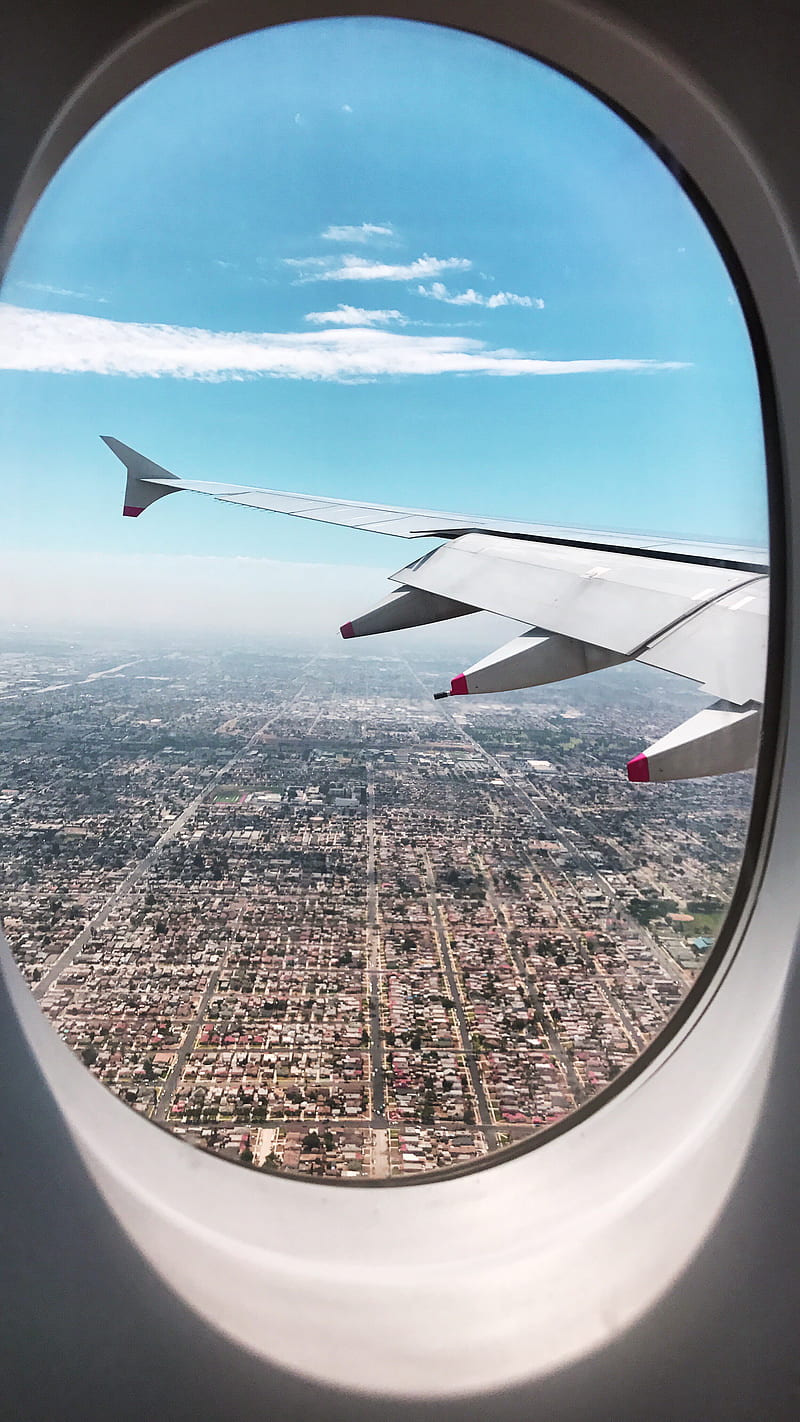 800x1422 Airplane wing over city during daytime, HD phone wallpaper