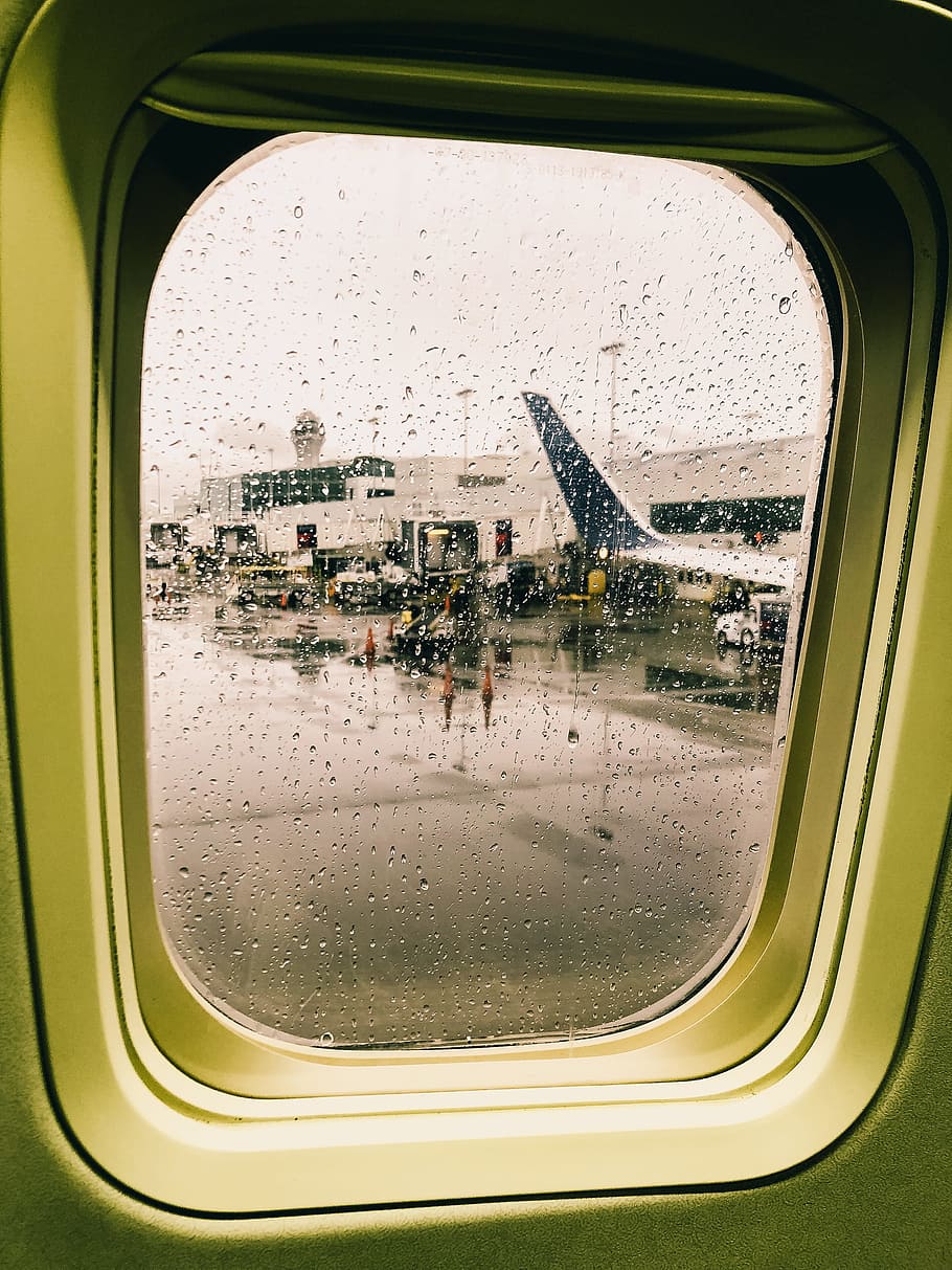 910x1213 HD wallpaper: airport seen from airplane window, rain, droplet, travel, window seat