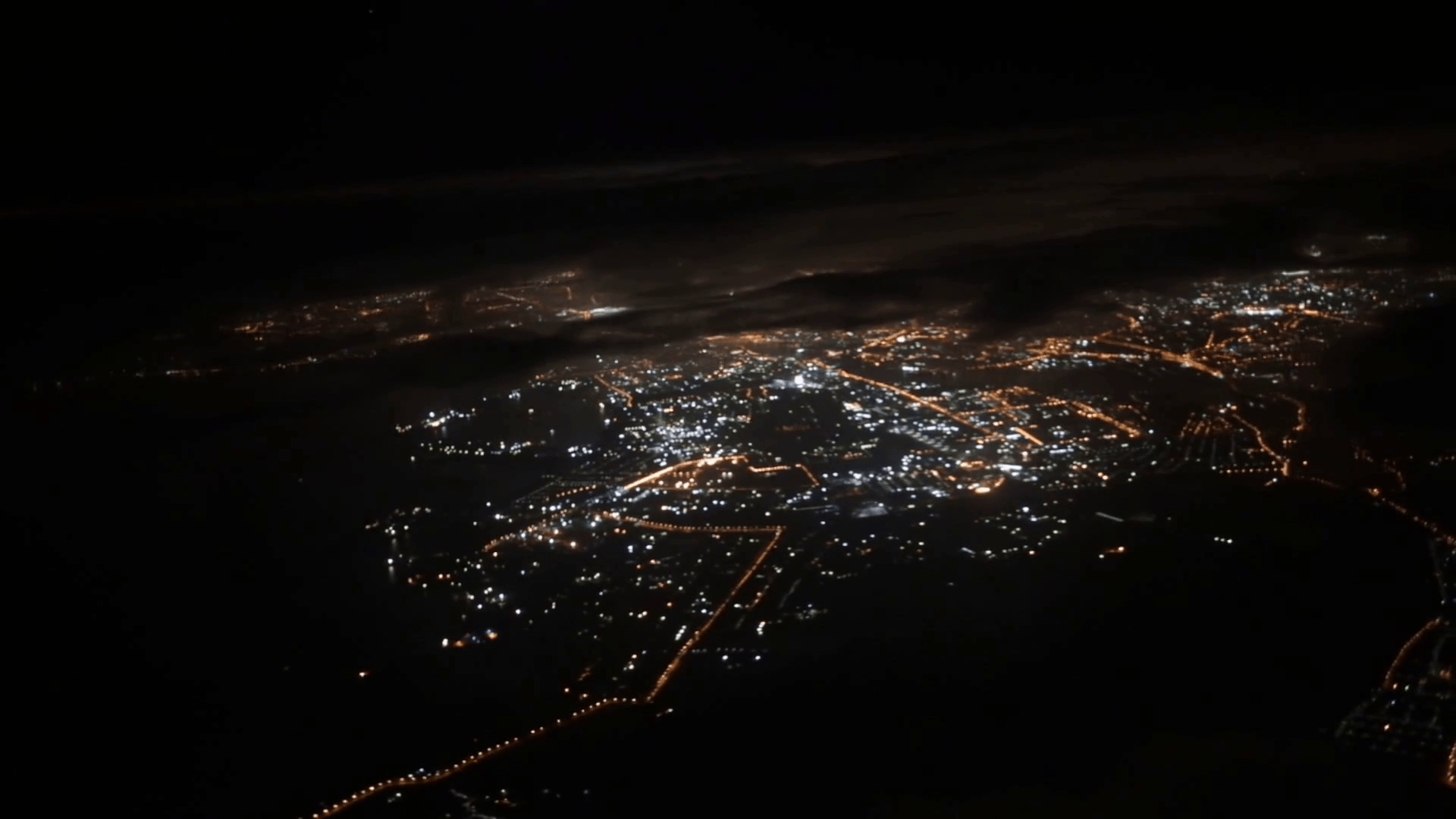 1920x1080 Travel concept. View from airplane window. Night city. Black clouds
