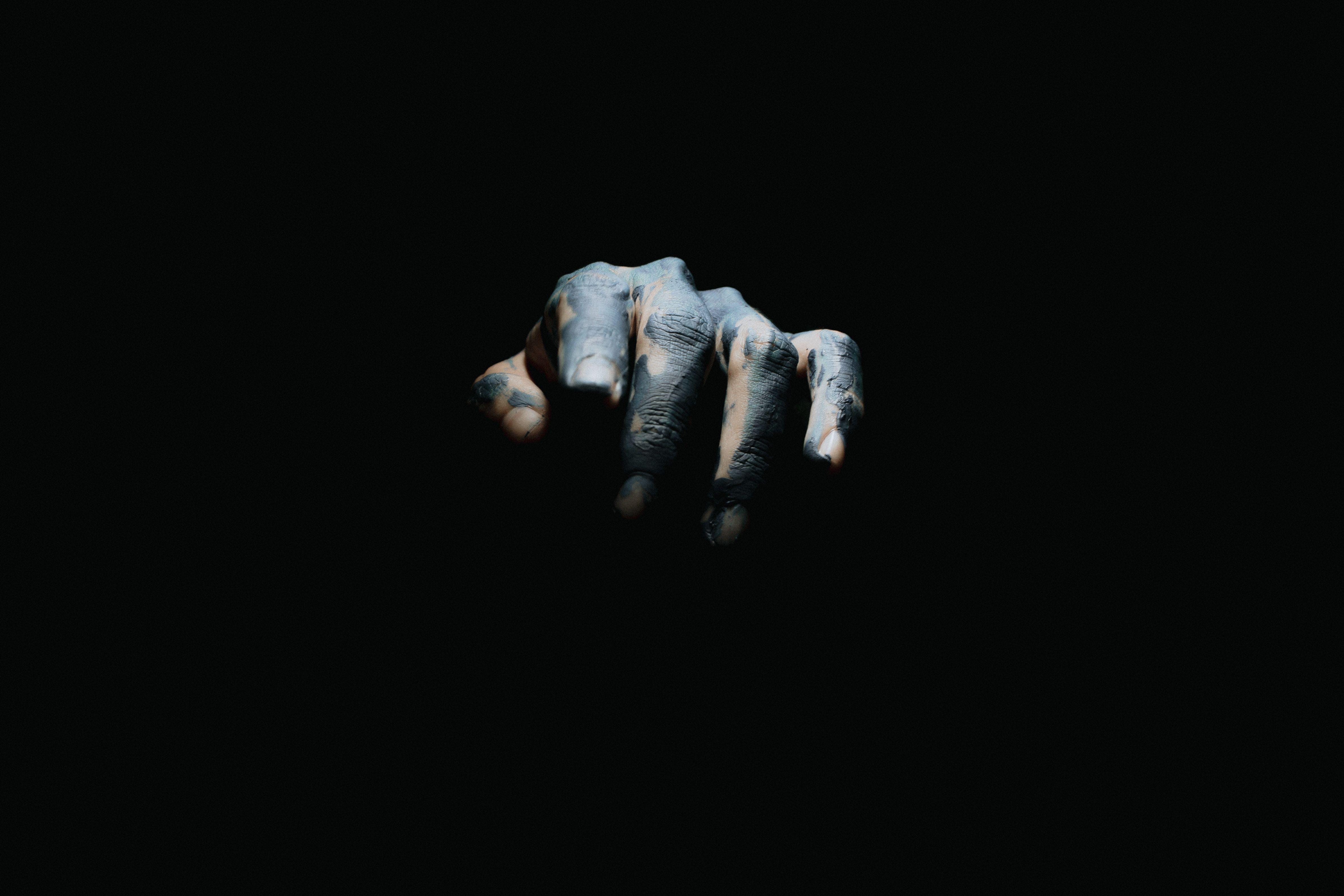 4757x3171 A Tattooed Hand on a Black Background · Free