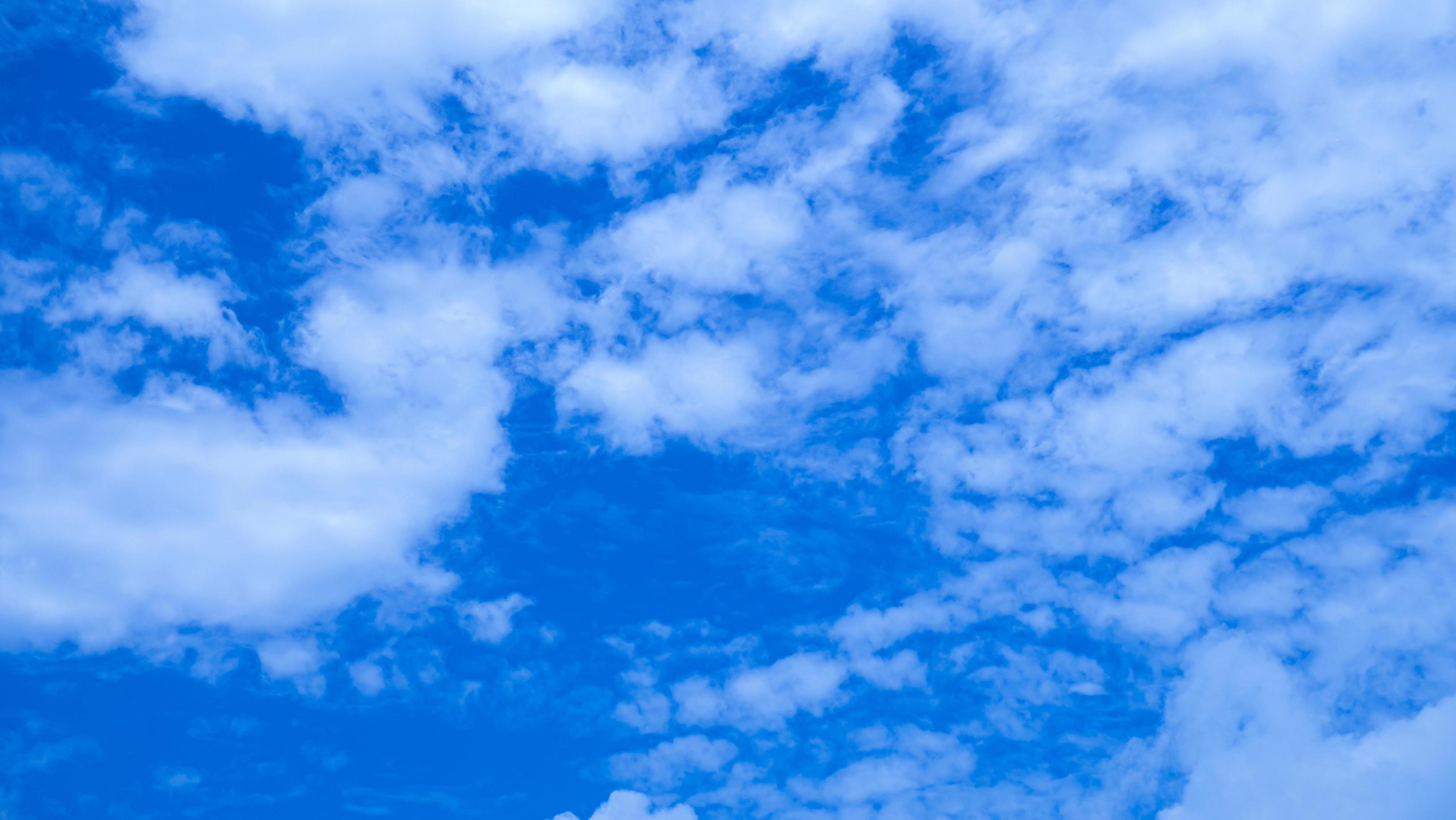 3480x1960 Blue sky and white cloud use for background. The sky is bright blue with white clouds scattered. Nature image with sky and clouds, perfect for use as wallpaper, banner or background. 6661845